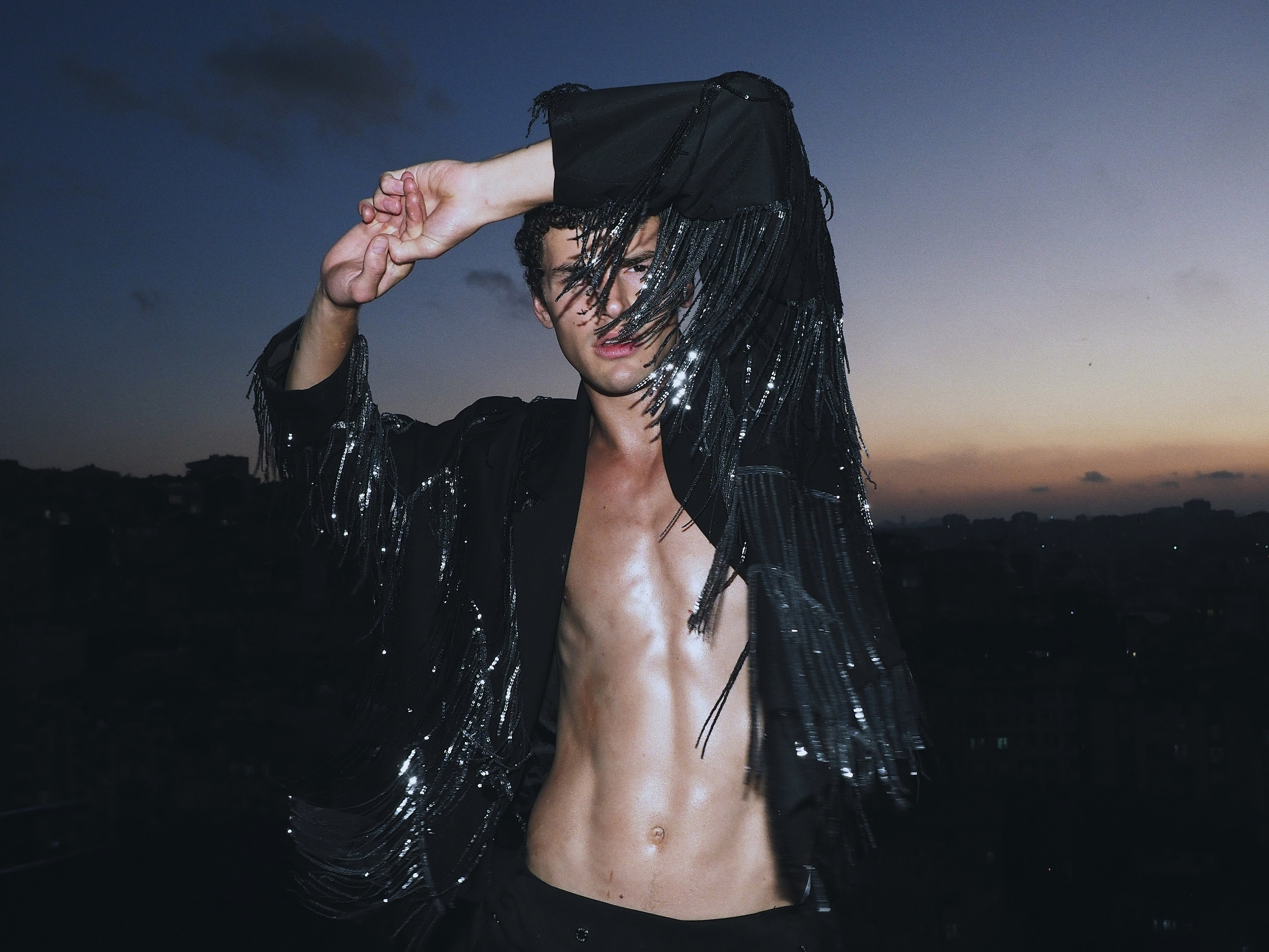 Mikolaj Smieszek wearing a black outfit in a contemporary fashion editorial