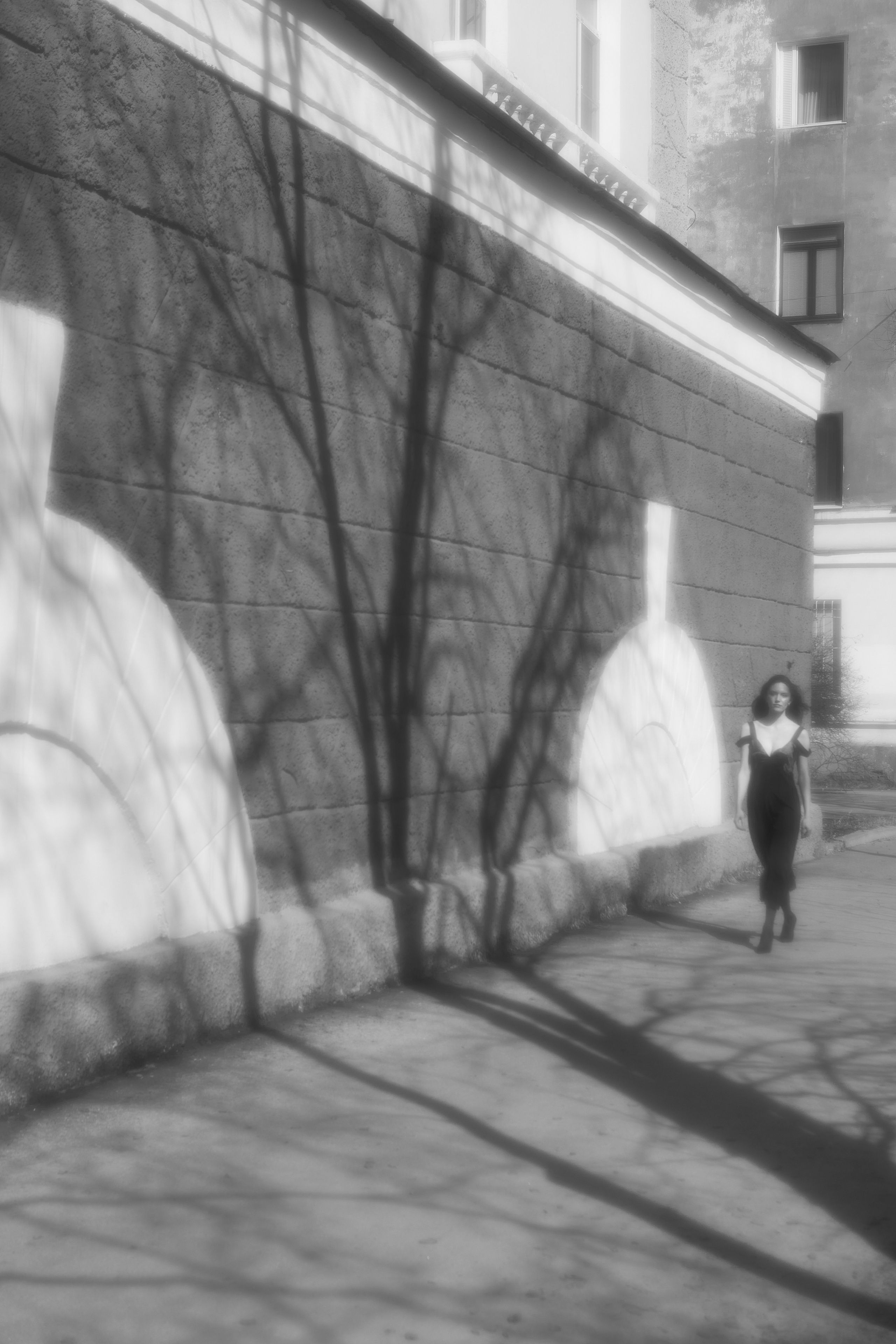 Black coat walking. Fashion Photographer Oxana Chernomorets