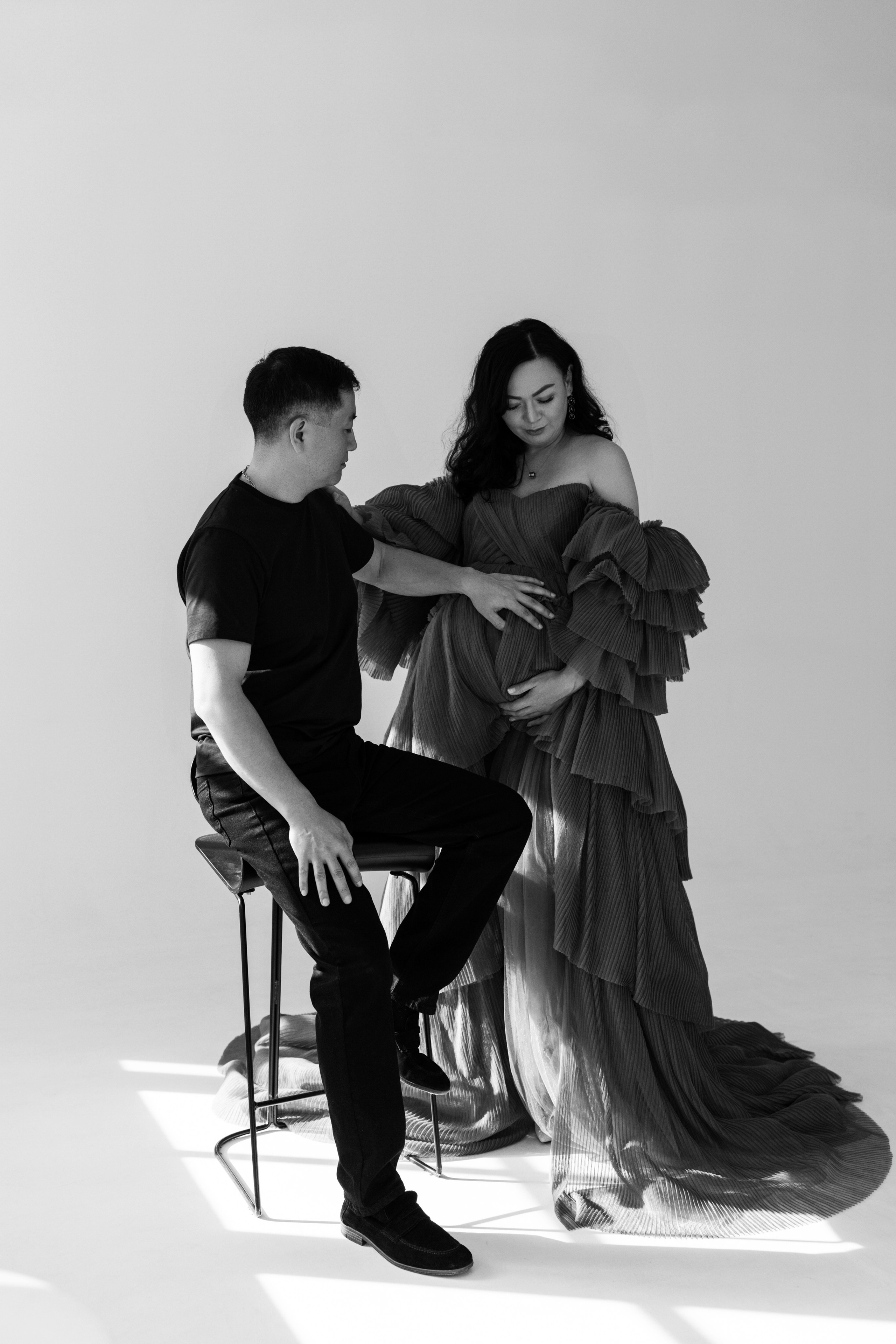 Pregnancy photo session with husband in studio