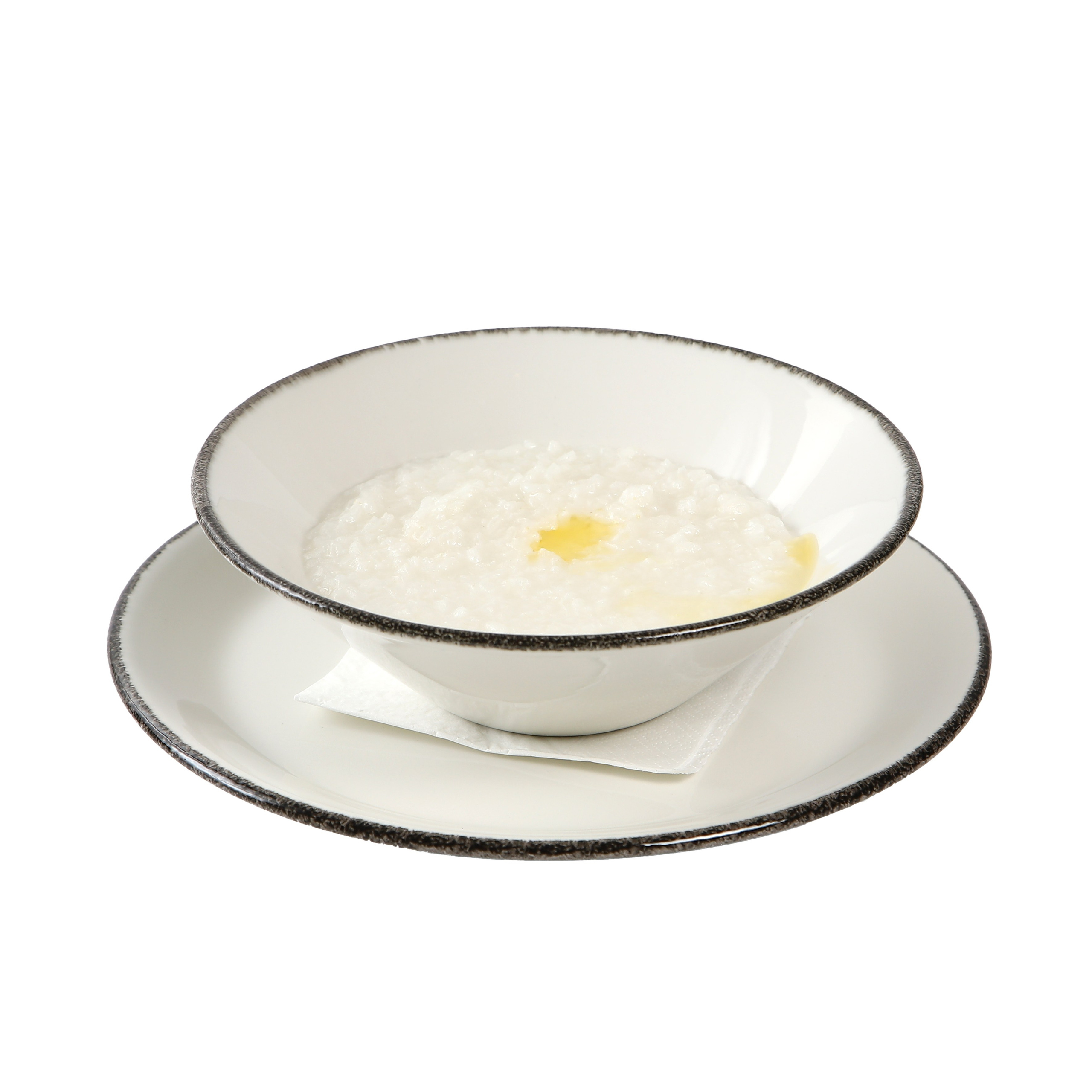 Фуд-фотография манной каши с маслом.