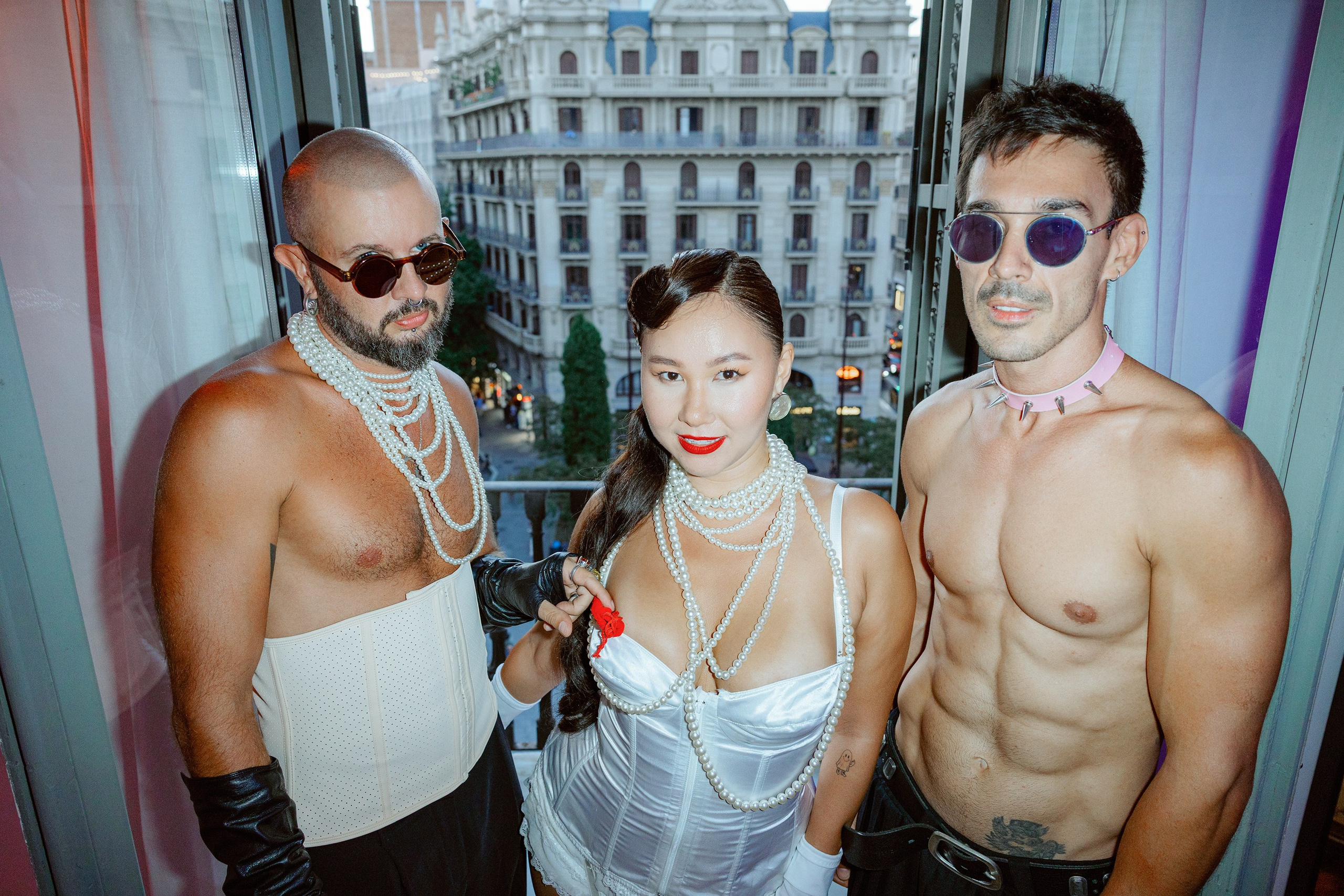 Friends raising glasses for a toast at a sunset birthday party