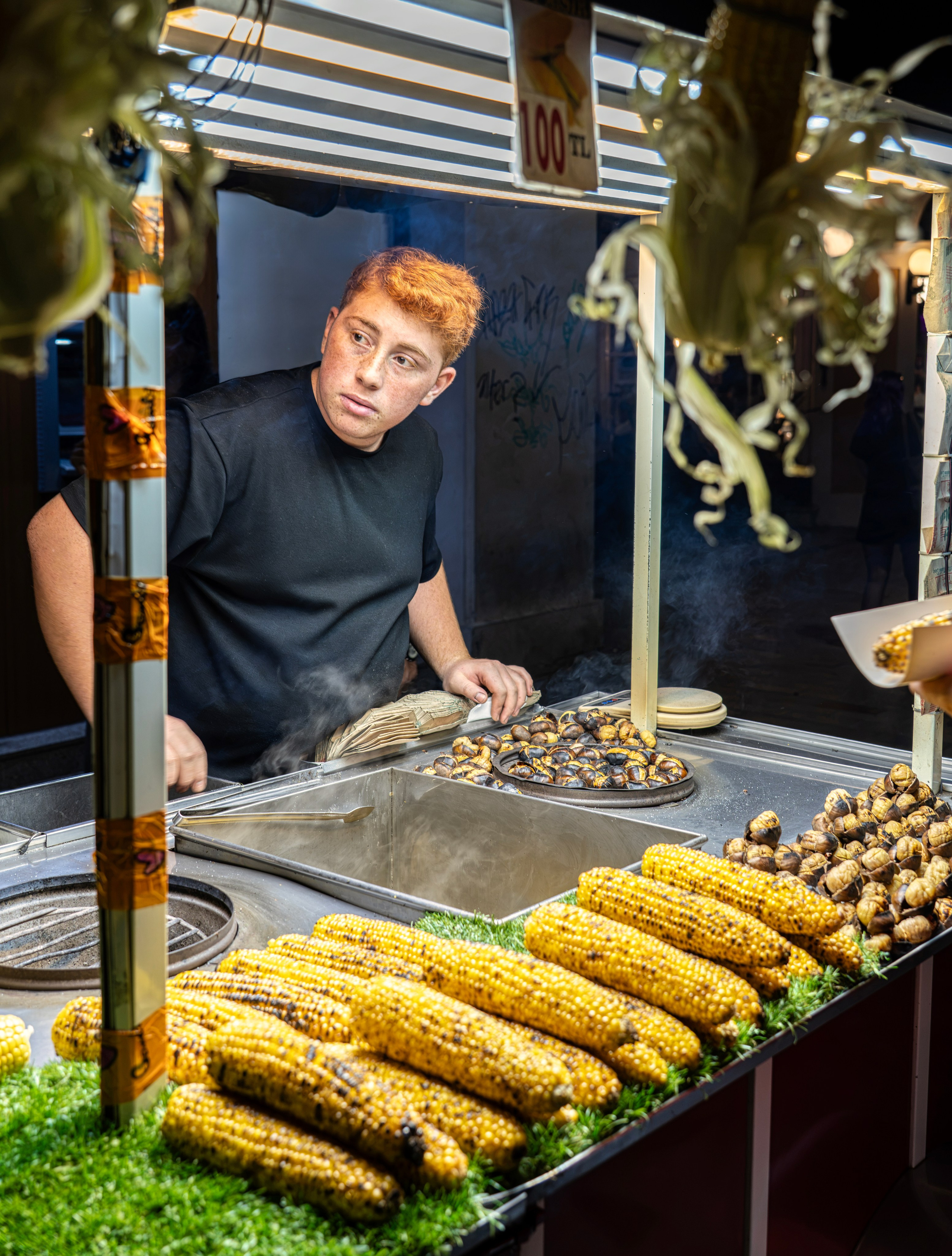 Portrait of a street vendor selling chestnuts and corn, Istiklal Street in Istanbul, photograph by Irina Ostapenko.
