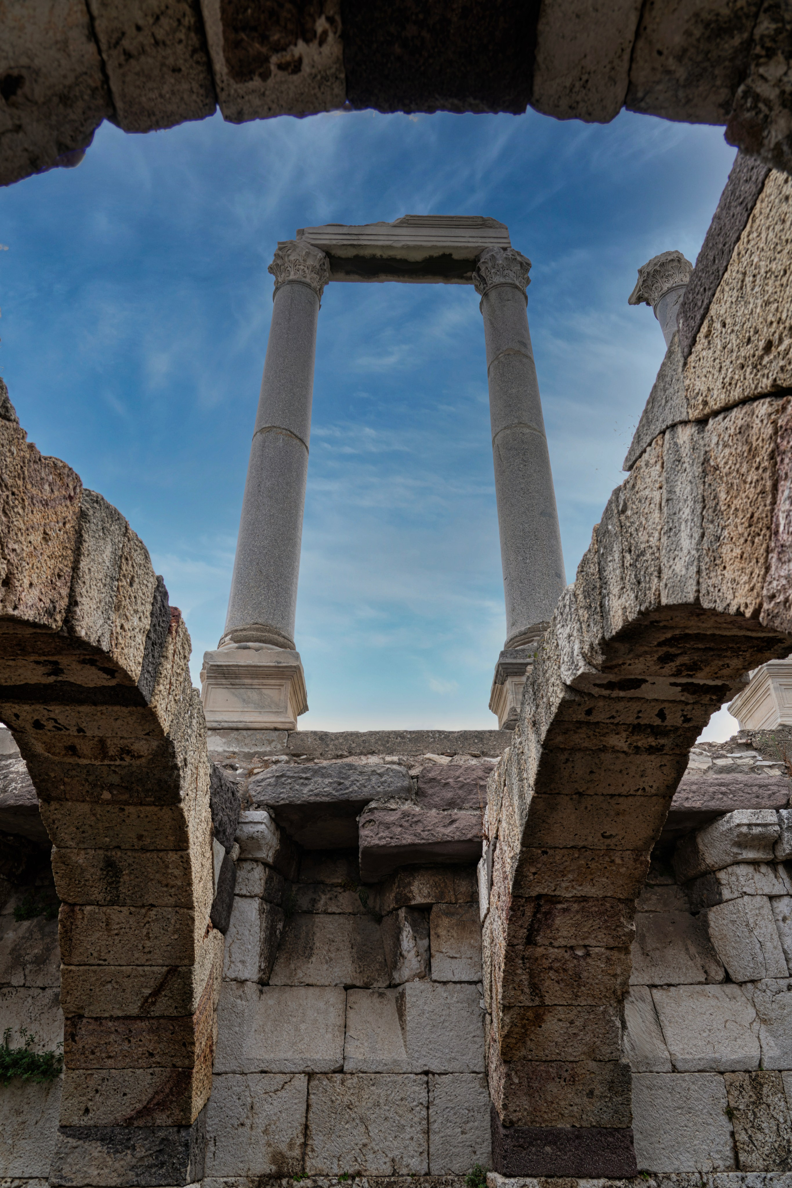 Ruins of ancient Smyrna, columns and arches at Kemeraltı market in Izmir, historical photography.