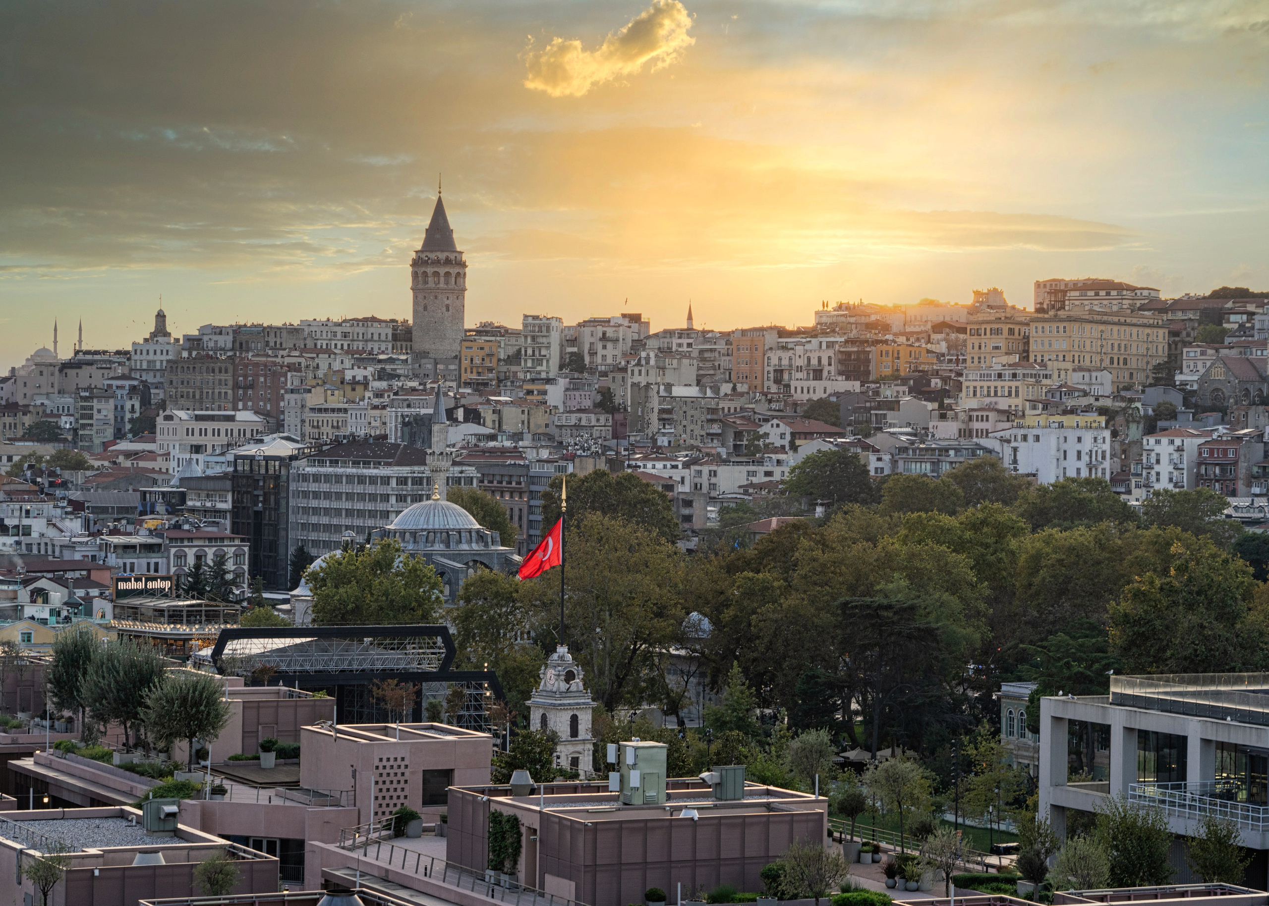 Istanbul panorama with the Galata Tower, sunset, city rooftops, historical photography.