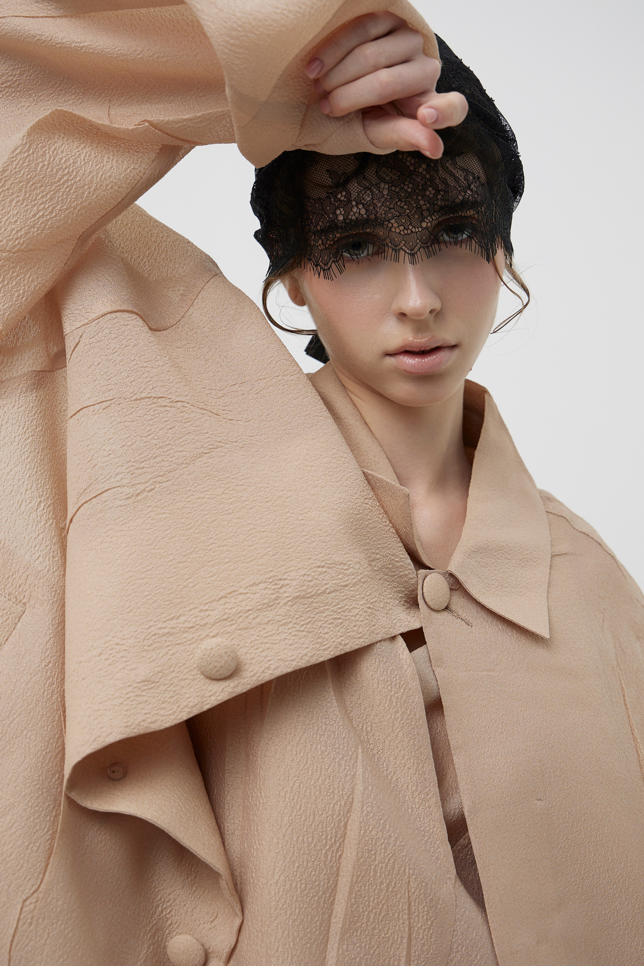 Close-up fashion portrait of model in designer coat with textured styling photographed for fashion brand campaign in Sydney