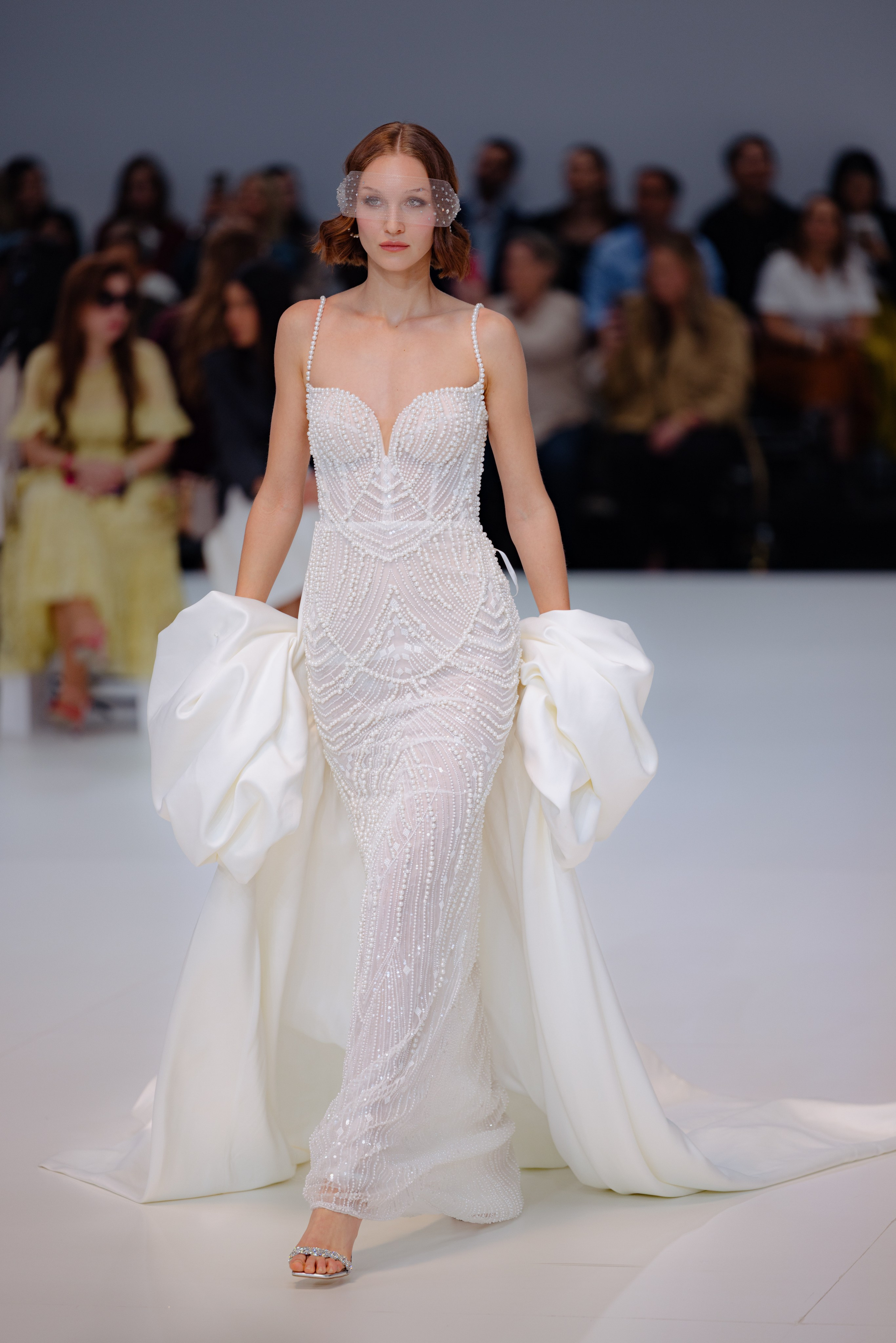 Bold structured gown by Katy Corso on stage at bridal fashion show