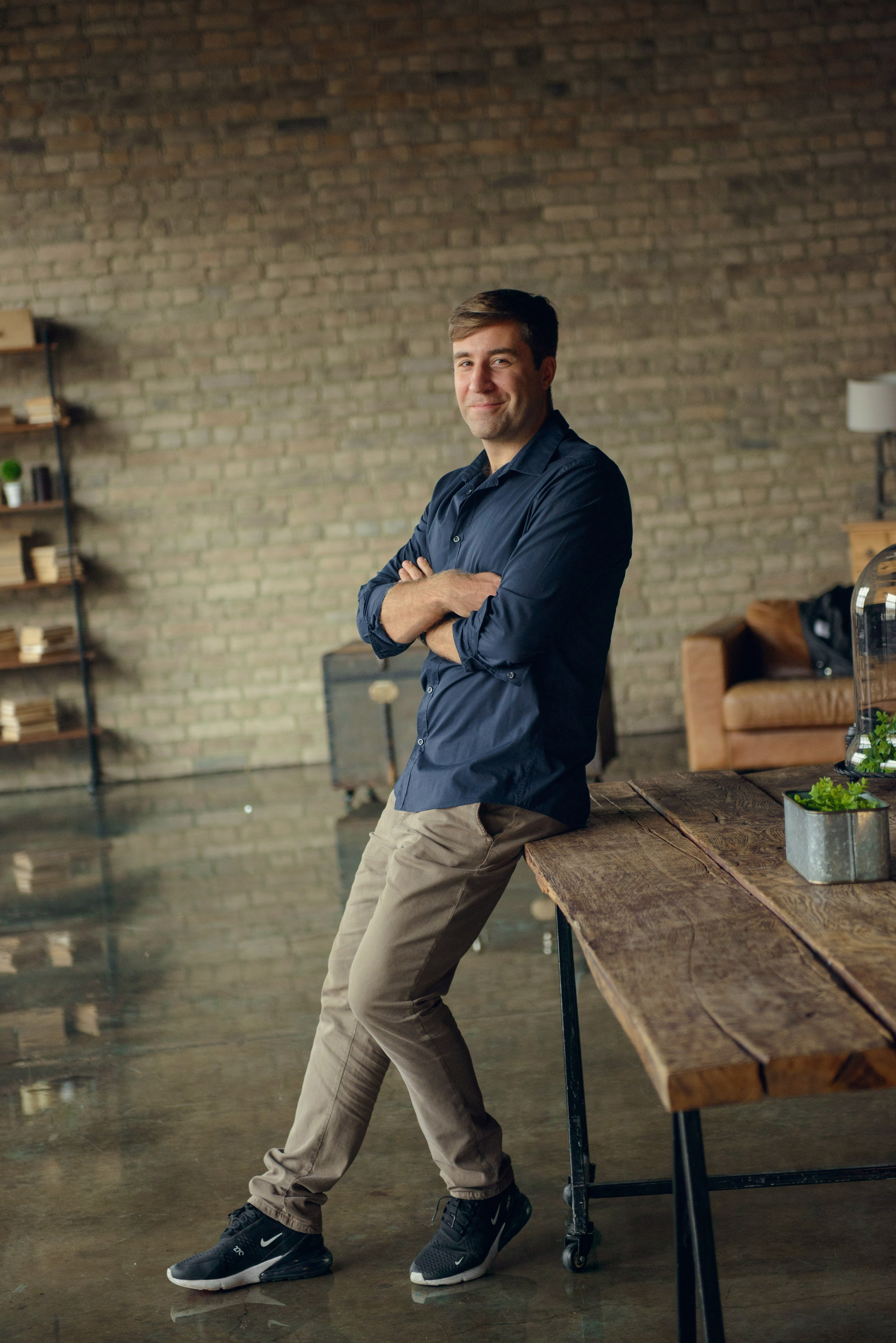 man in a dark photo studio