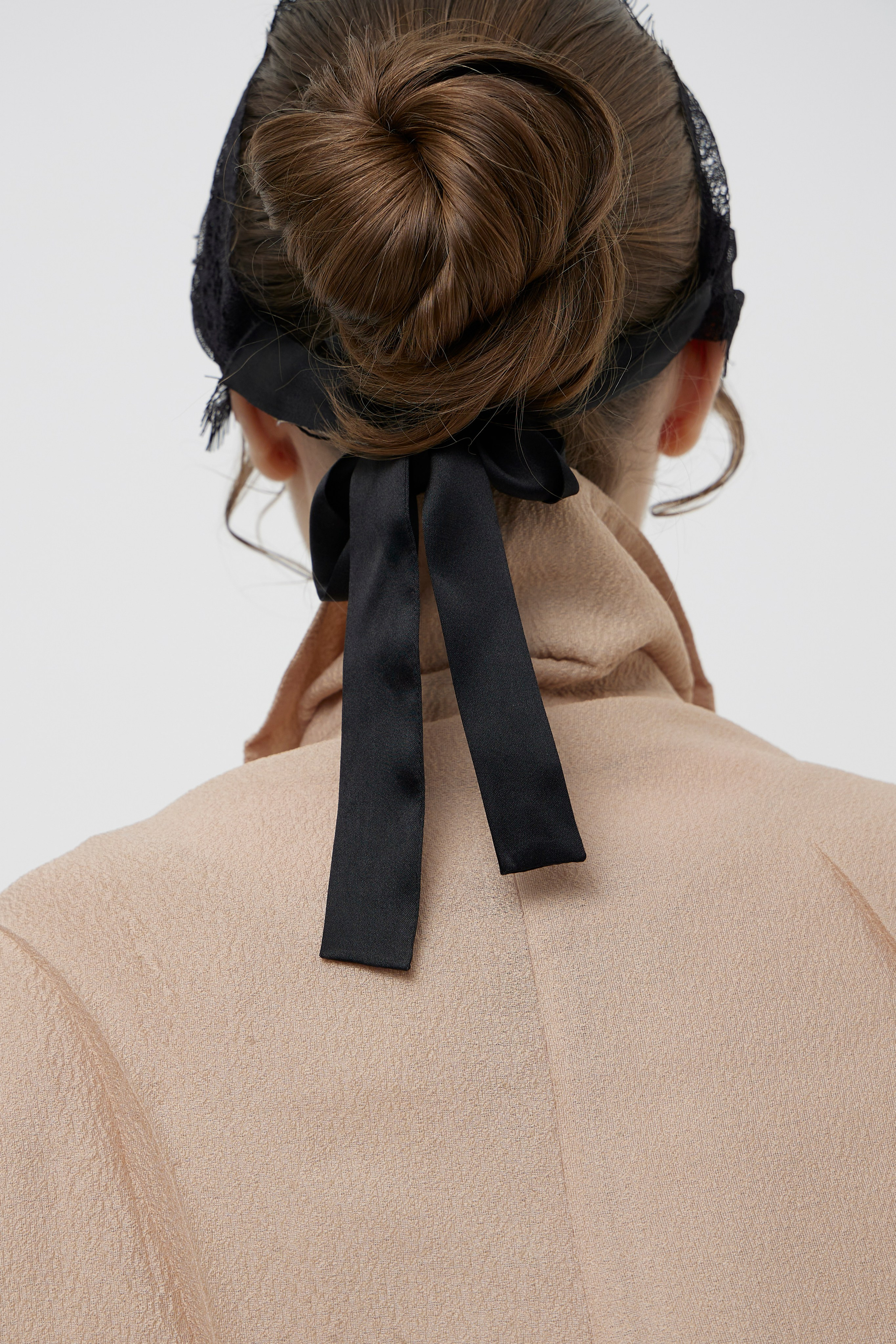 Detail fashion portrait showing hairstyle and garment styling photographed for fashion brand campaign photography in Sydney