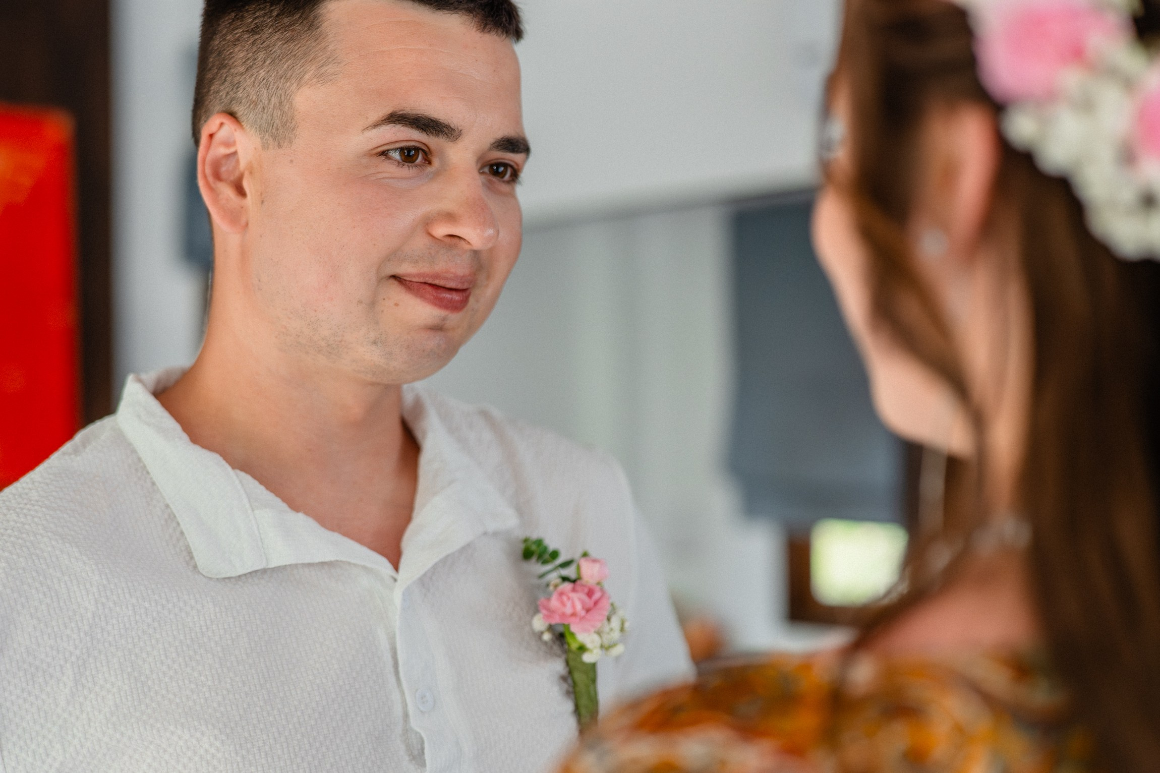Bride and groom exchanging vows on a private sunset beach