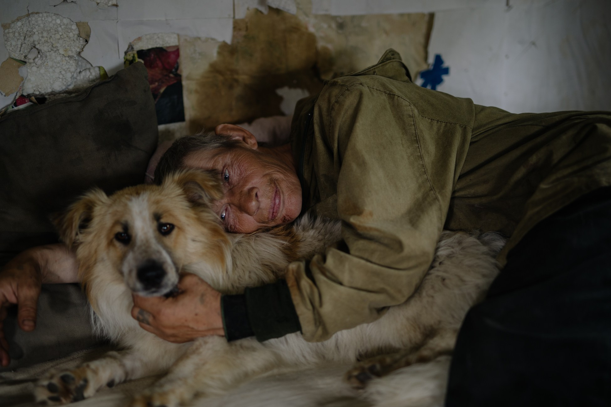 Guard Igor Ivanov (Russian) with his dog Baton in an old fisherman's hut on the territory of the National economic sea fishing artel "Larga".