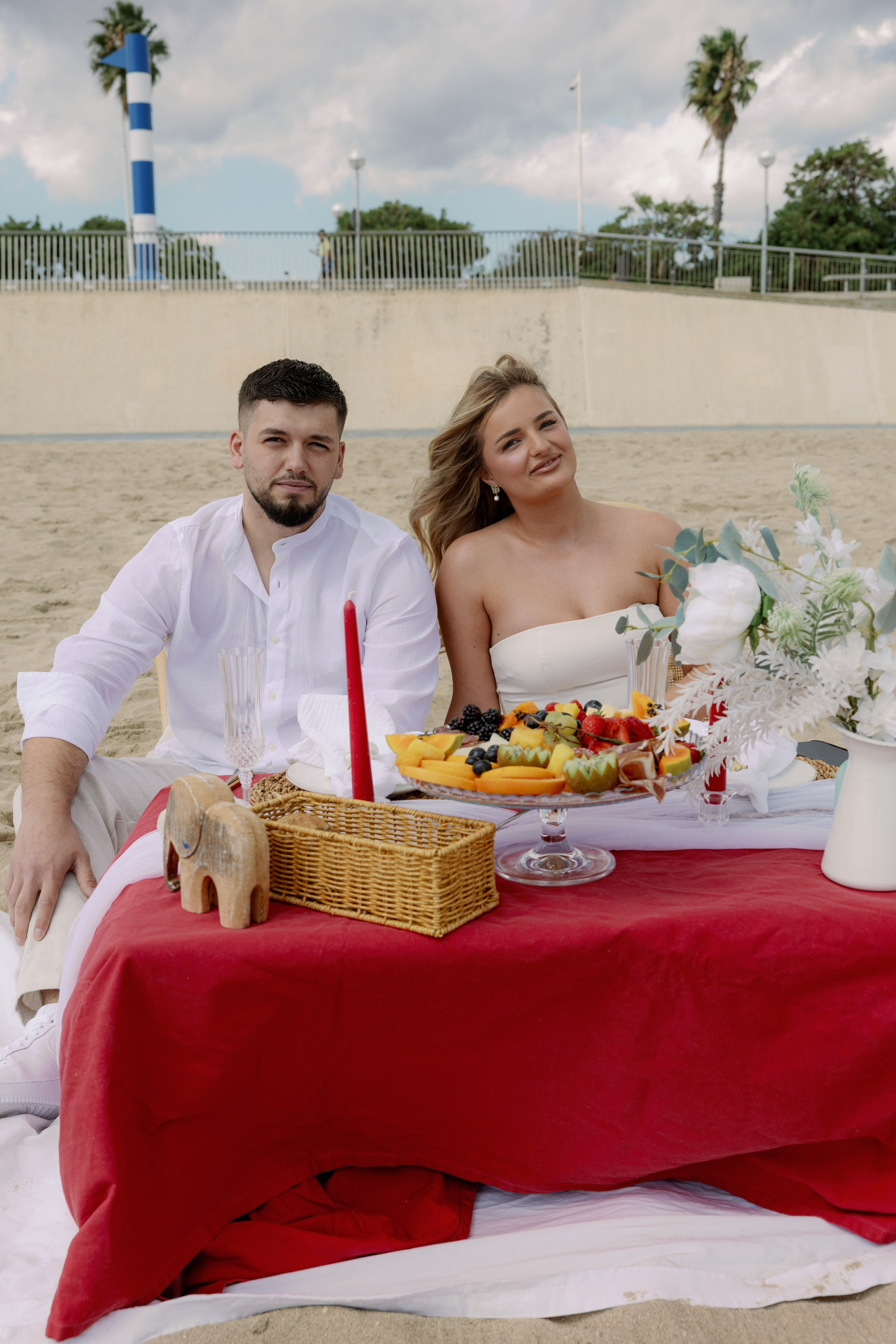 Man proposing to his girlfriend on a rooftop with Sagrada Familia view