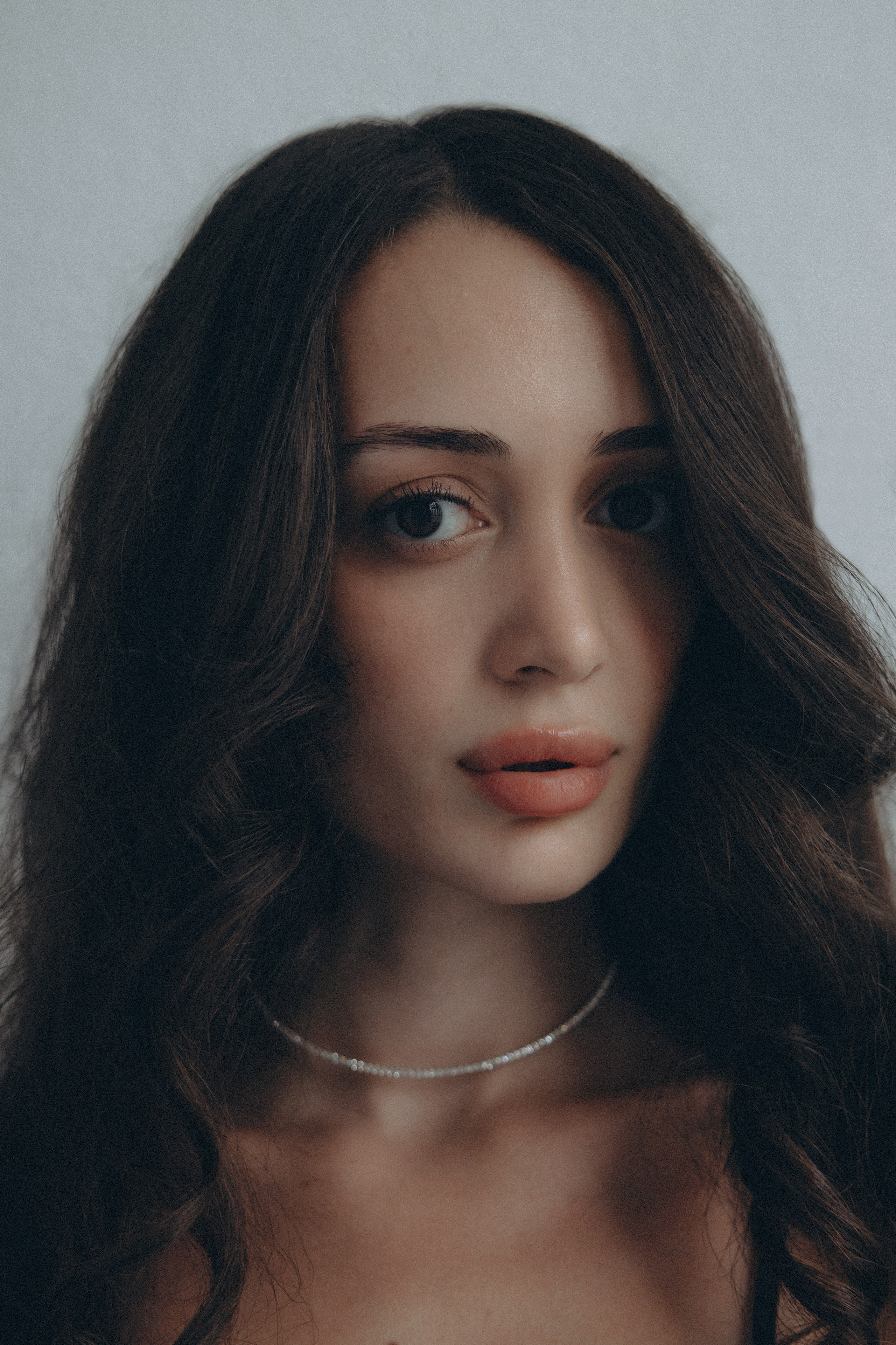 Minimalist photo of a woman with no makeup