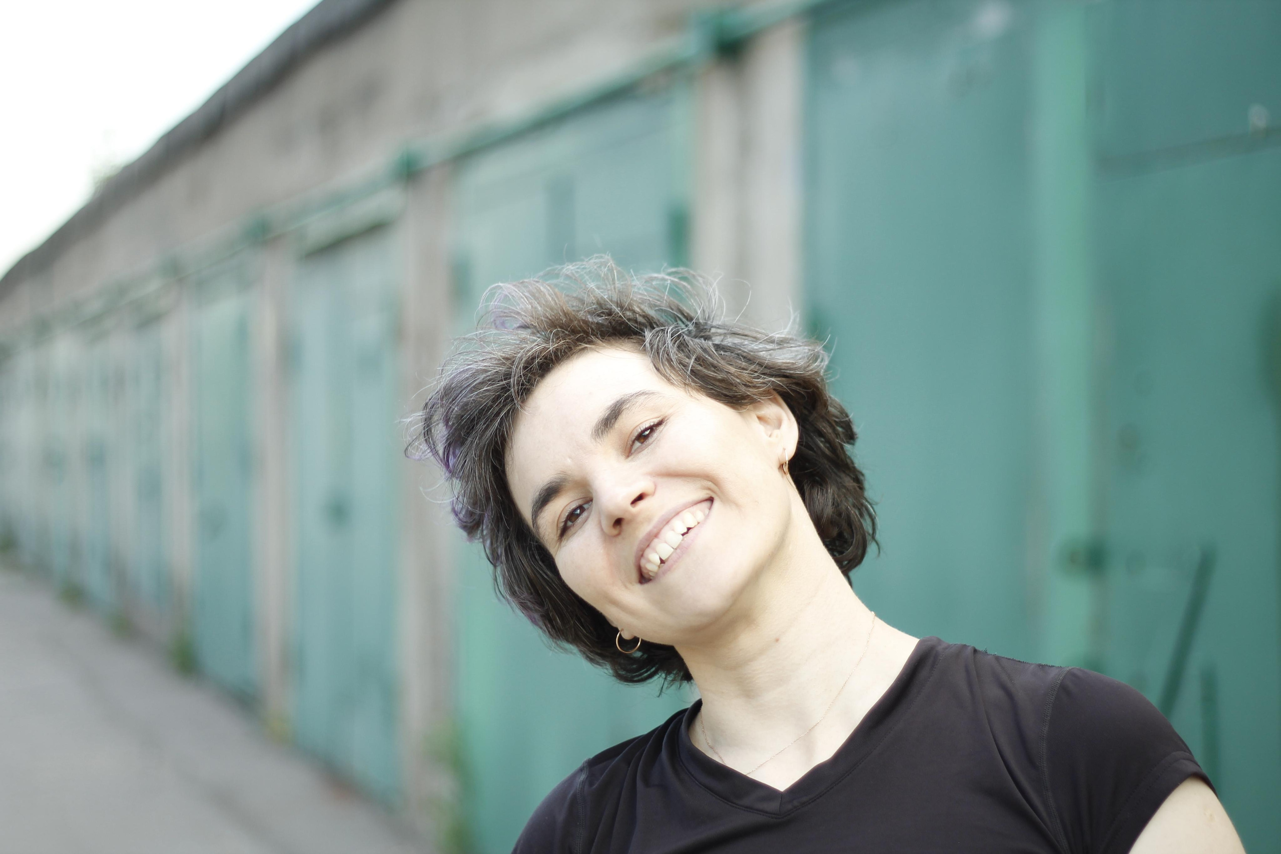 Woman dancing near the garages