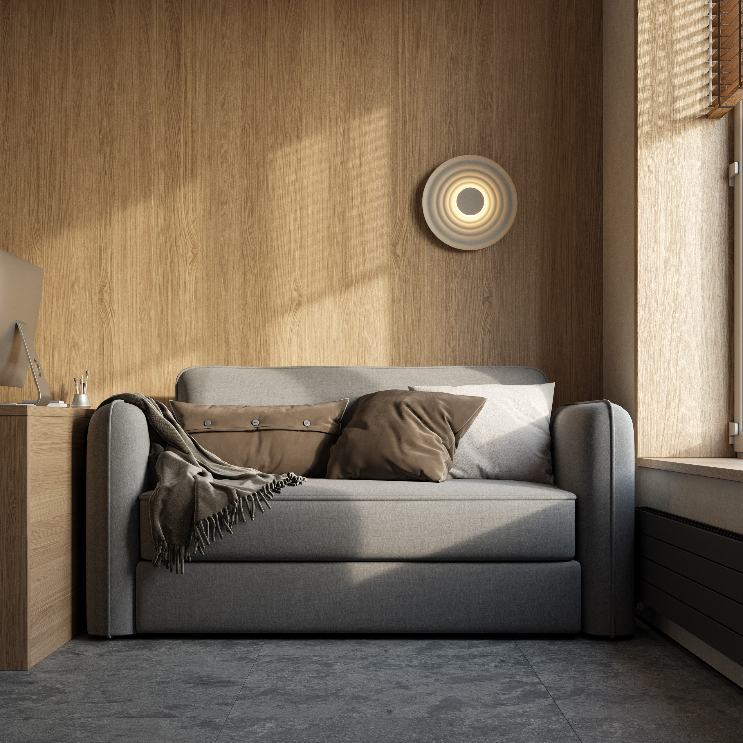 Уголок для чтения с диваном у окна в домашнем кабинете