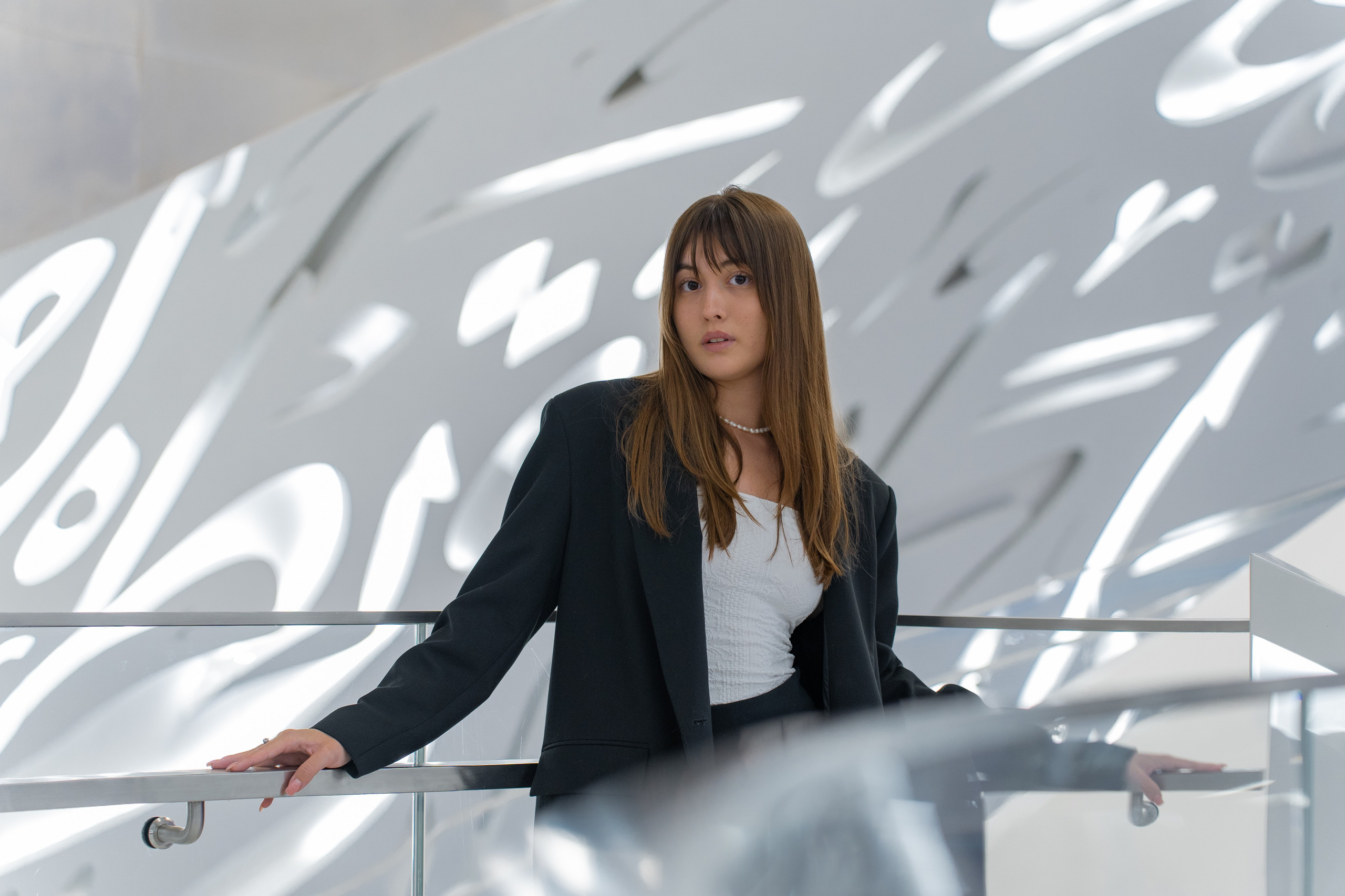 Woman in sleek dress at iconic Dubai landmark