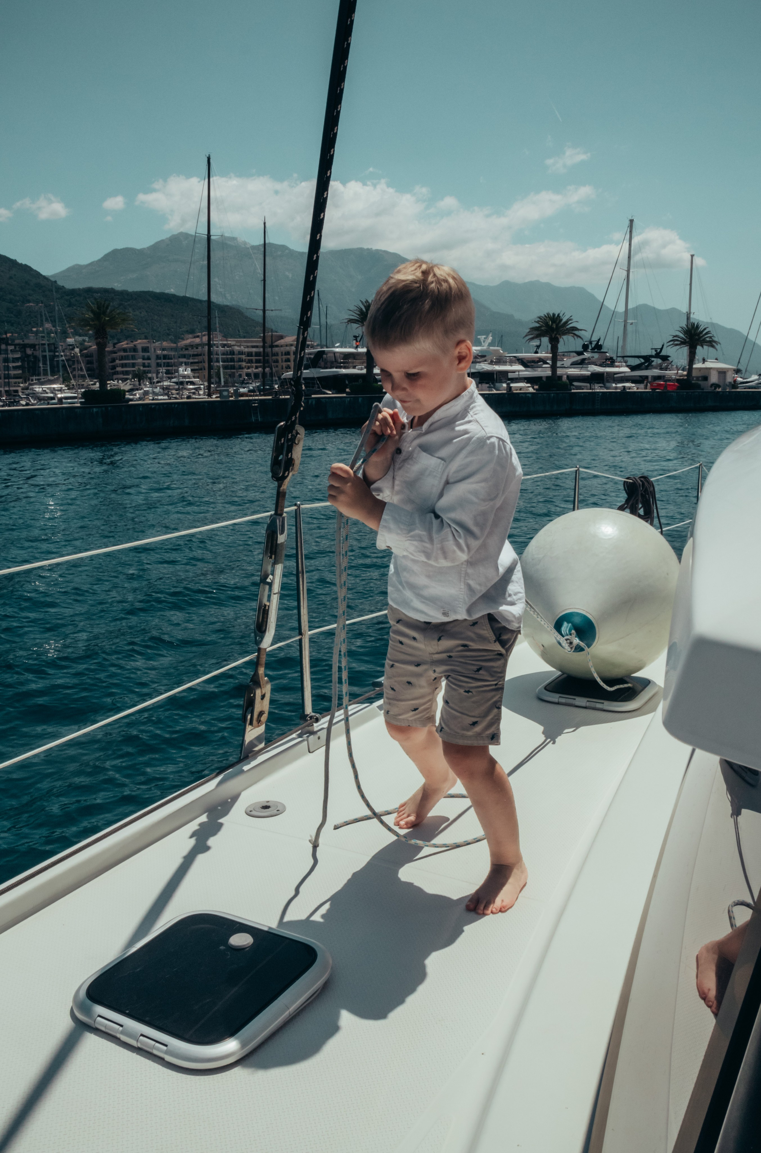Boat tour with Anna, Roman and Tim. Portrait photographer in Tivat Montenegro Katerina Kirsanova