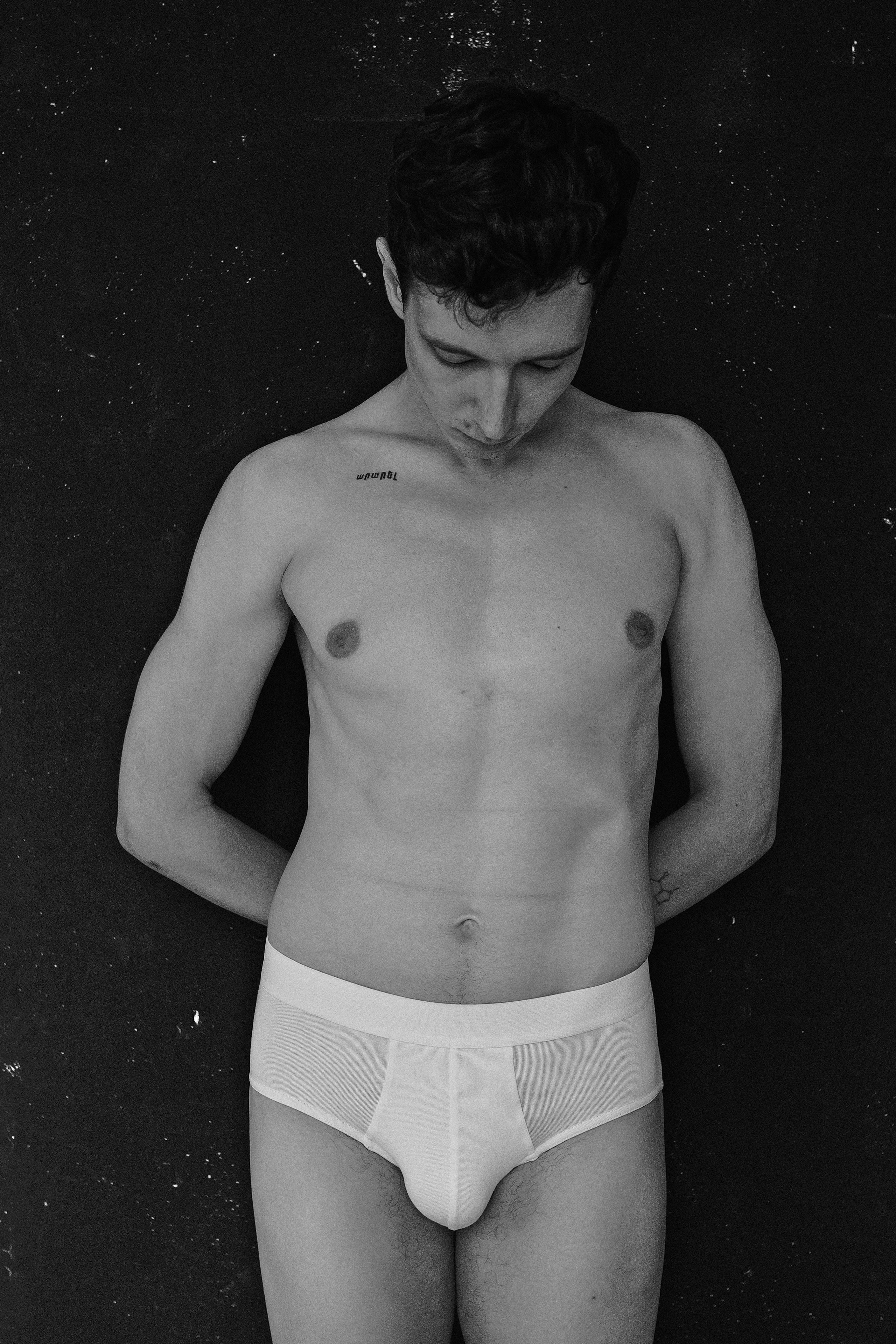 Abstract Barcelona portrait highlighting a man’s facial expression in shadows