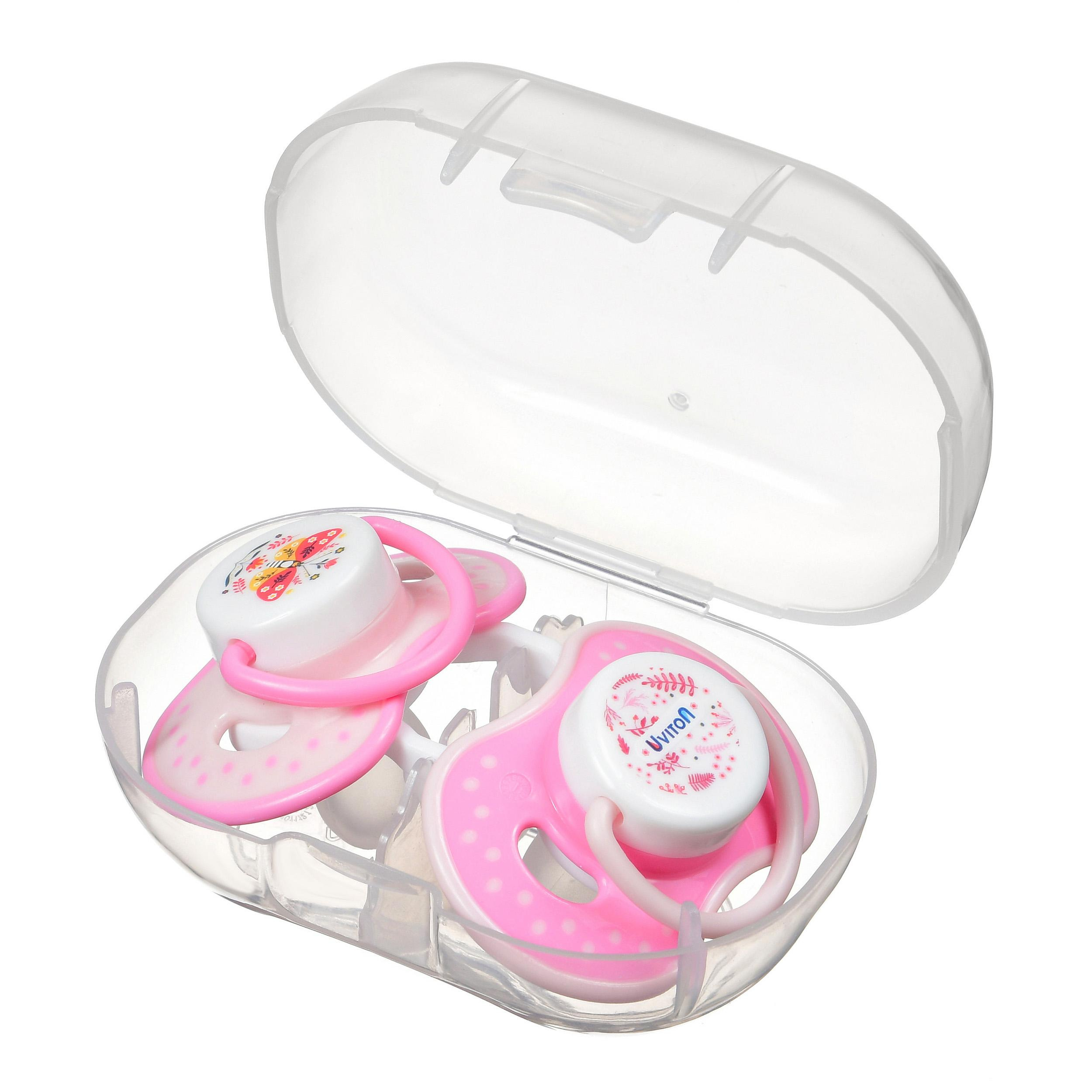 Две розовых пустышки в открытой упаковке.