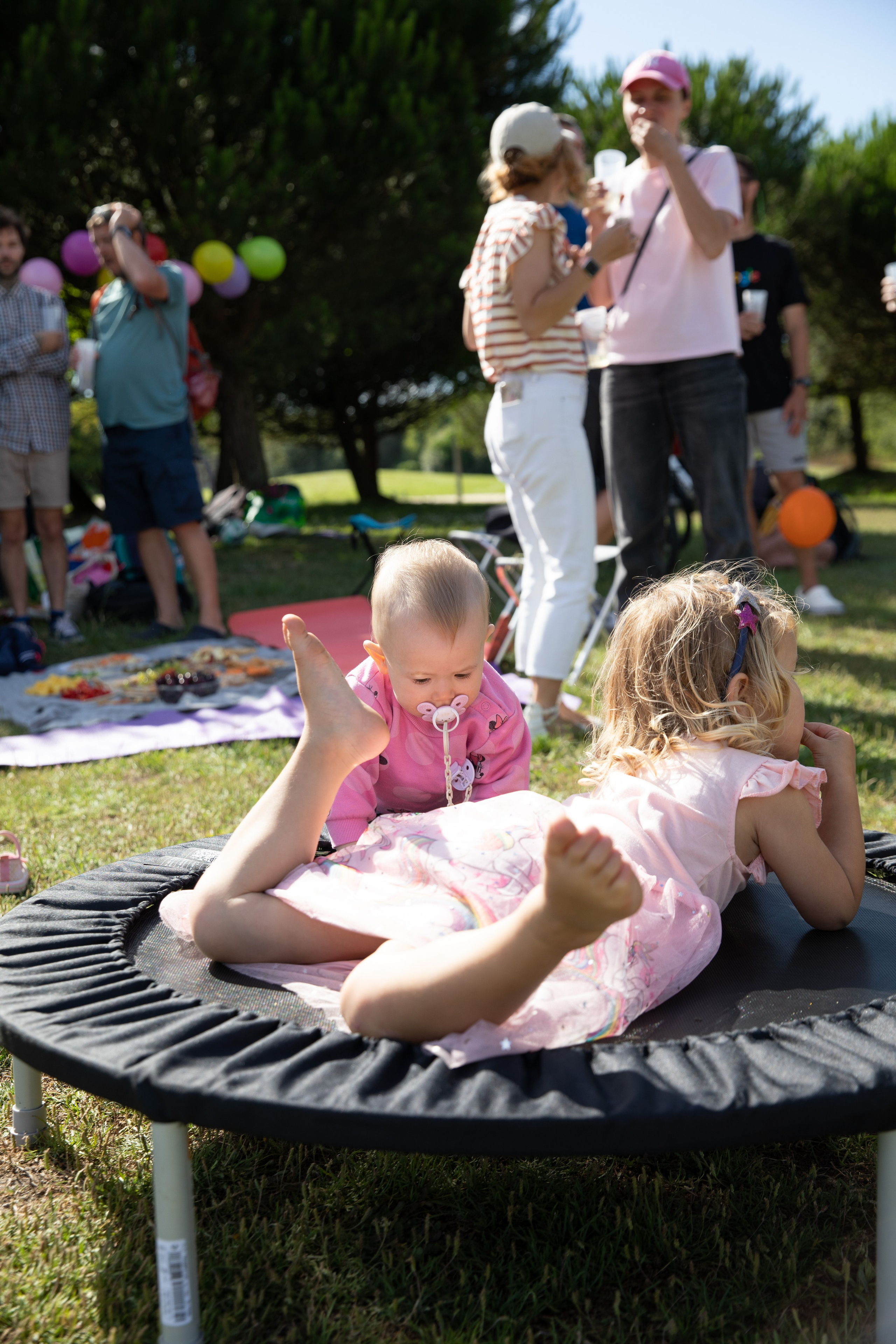 Birthday fun with children playing and bubbles in the park, captured in a photo session