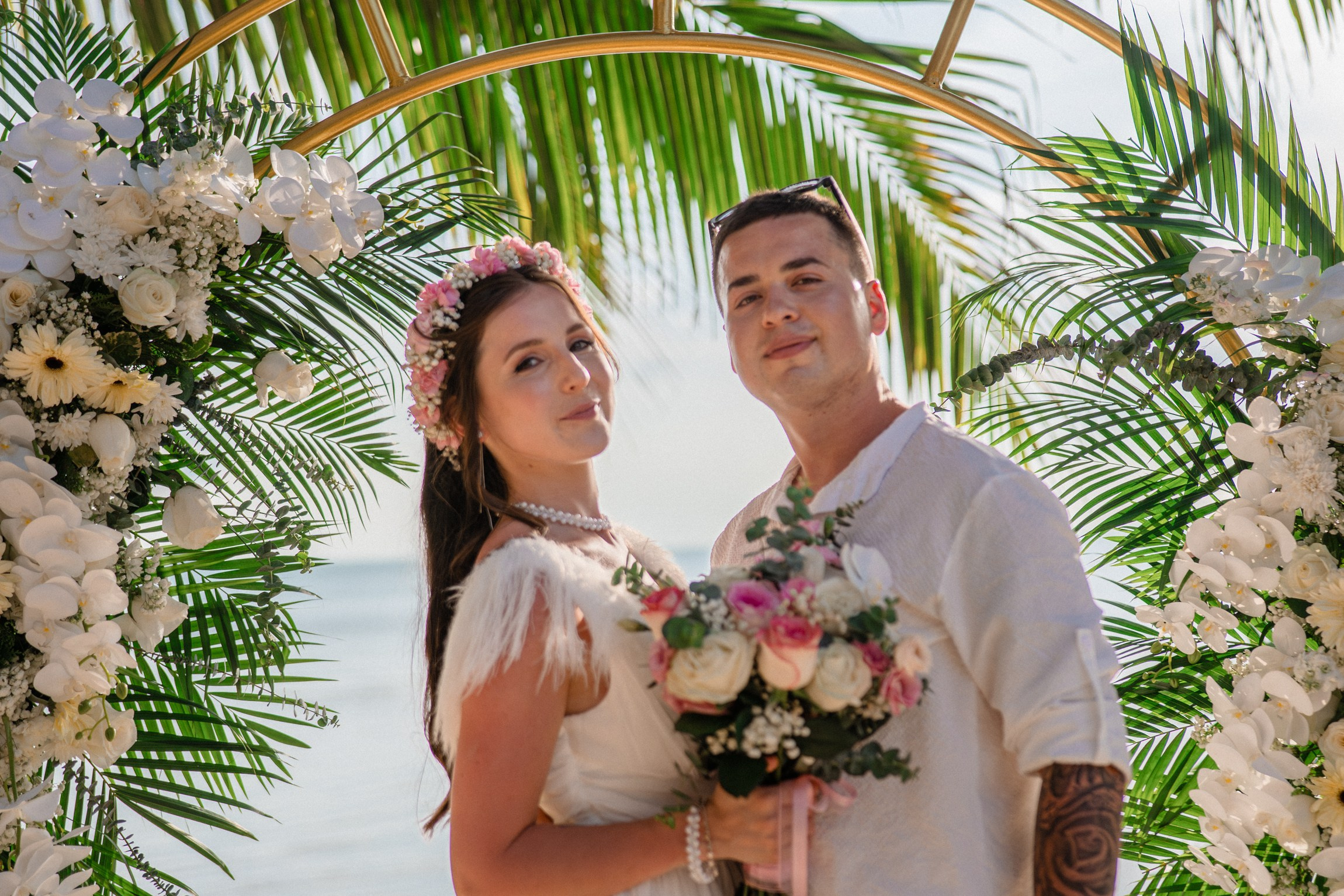 Bride and groom during a romantic beach wedding ceremony on Koh Samui, Thailand, surrounded by tropical scenery and ocean views