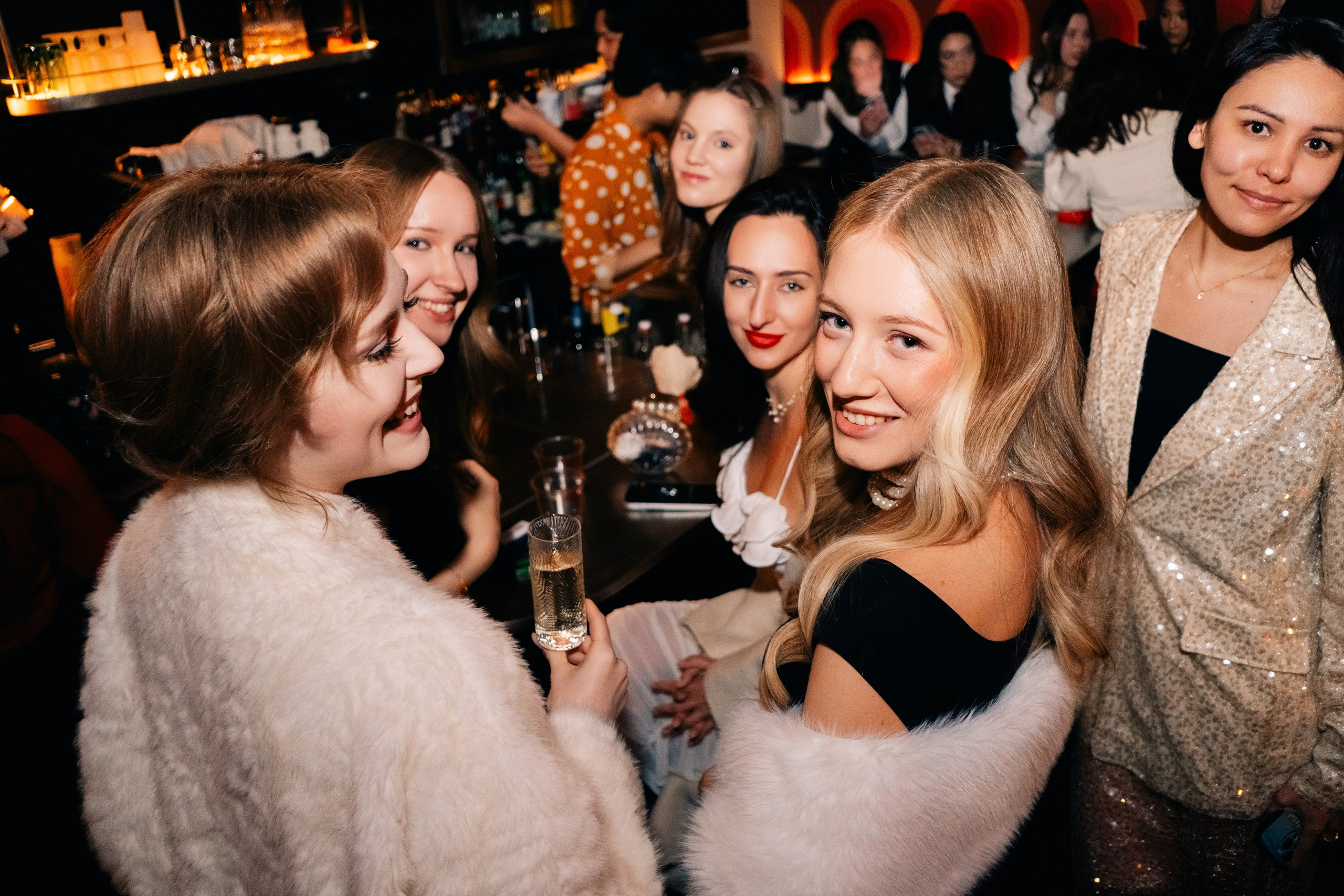 Close-up, laughter and drinks, Marilyn Party in Shanghai, candid moment.