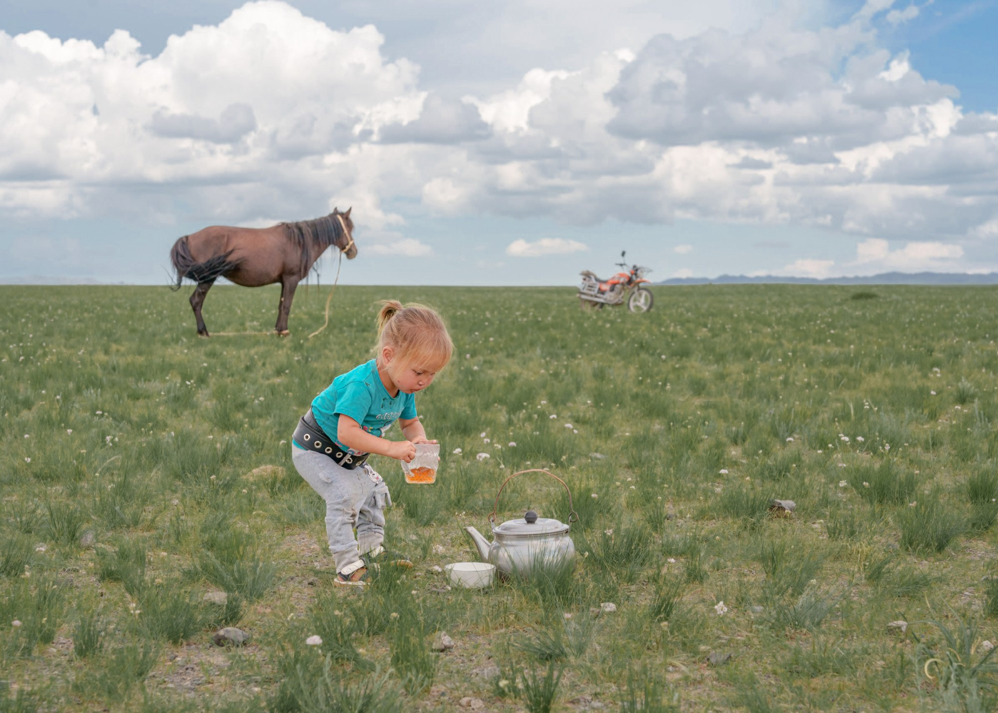 Nomad children watch the traditional foal taming in Mongolia