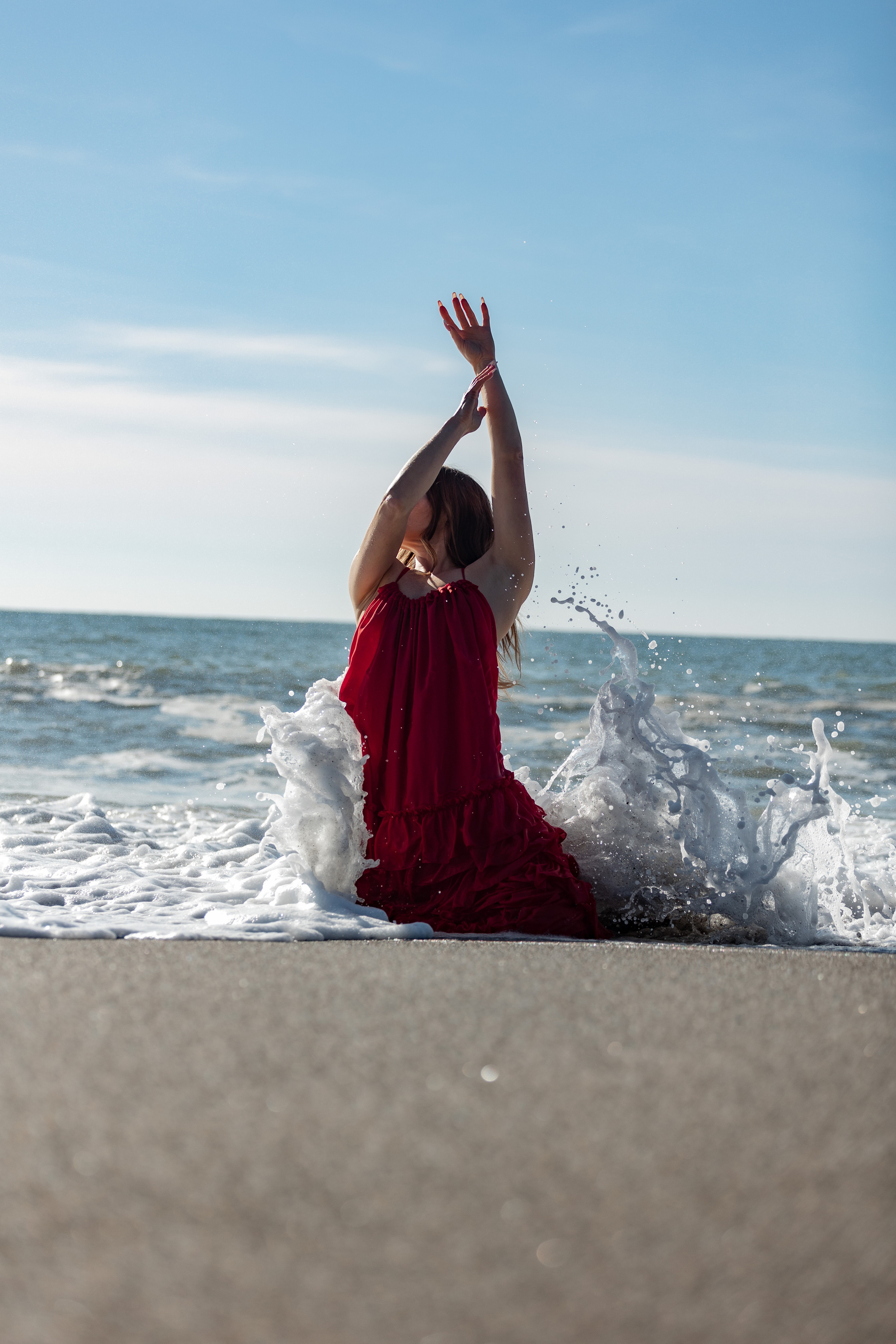 Shooting in a red dress in the sea. Photographer in Saint-Petersburg and Moscow Max Spector