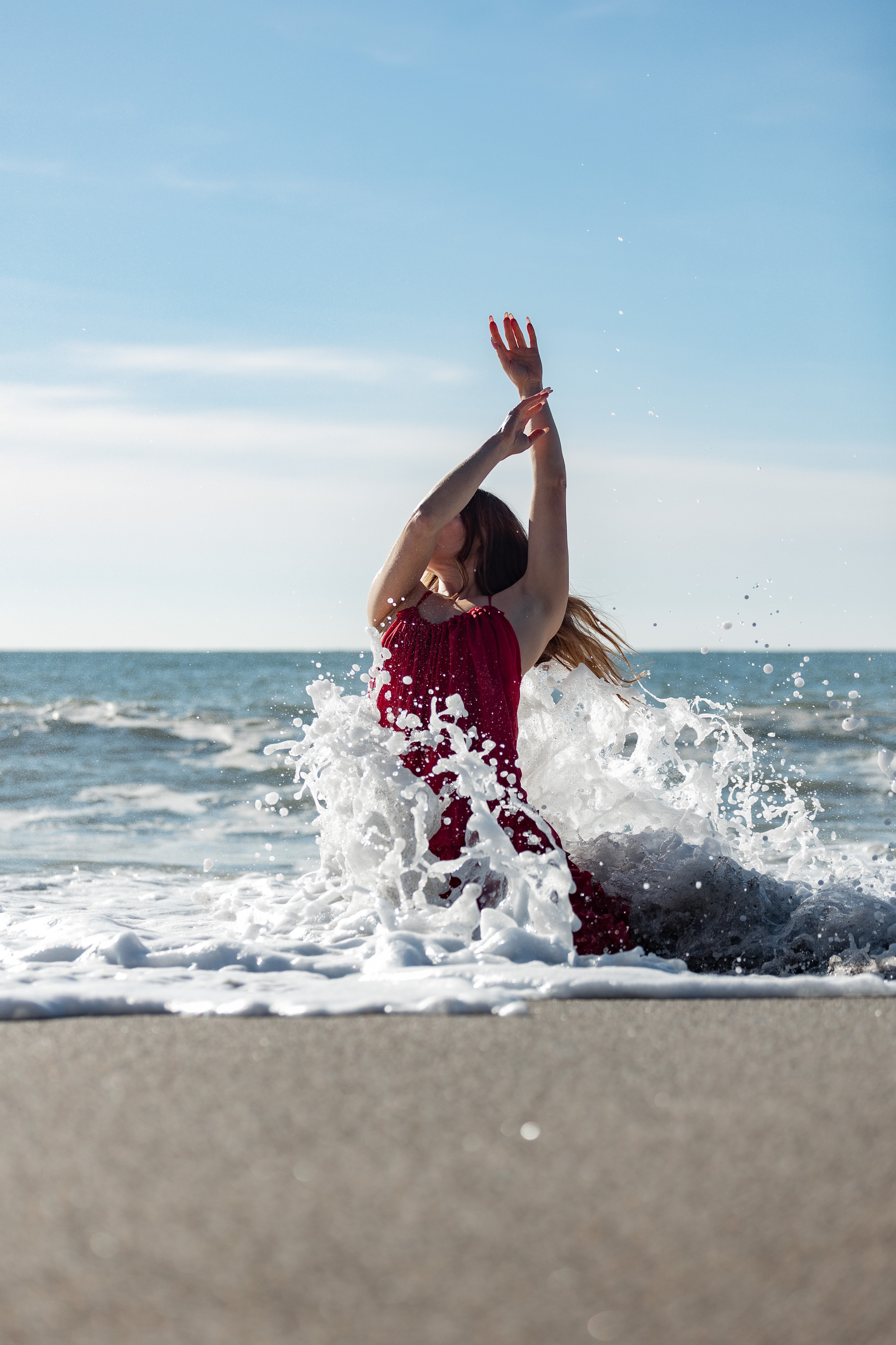 Shooting in a red dress in the sea. Photographer in Saint-Petersburg and Moscow Max Spector