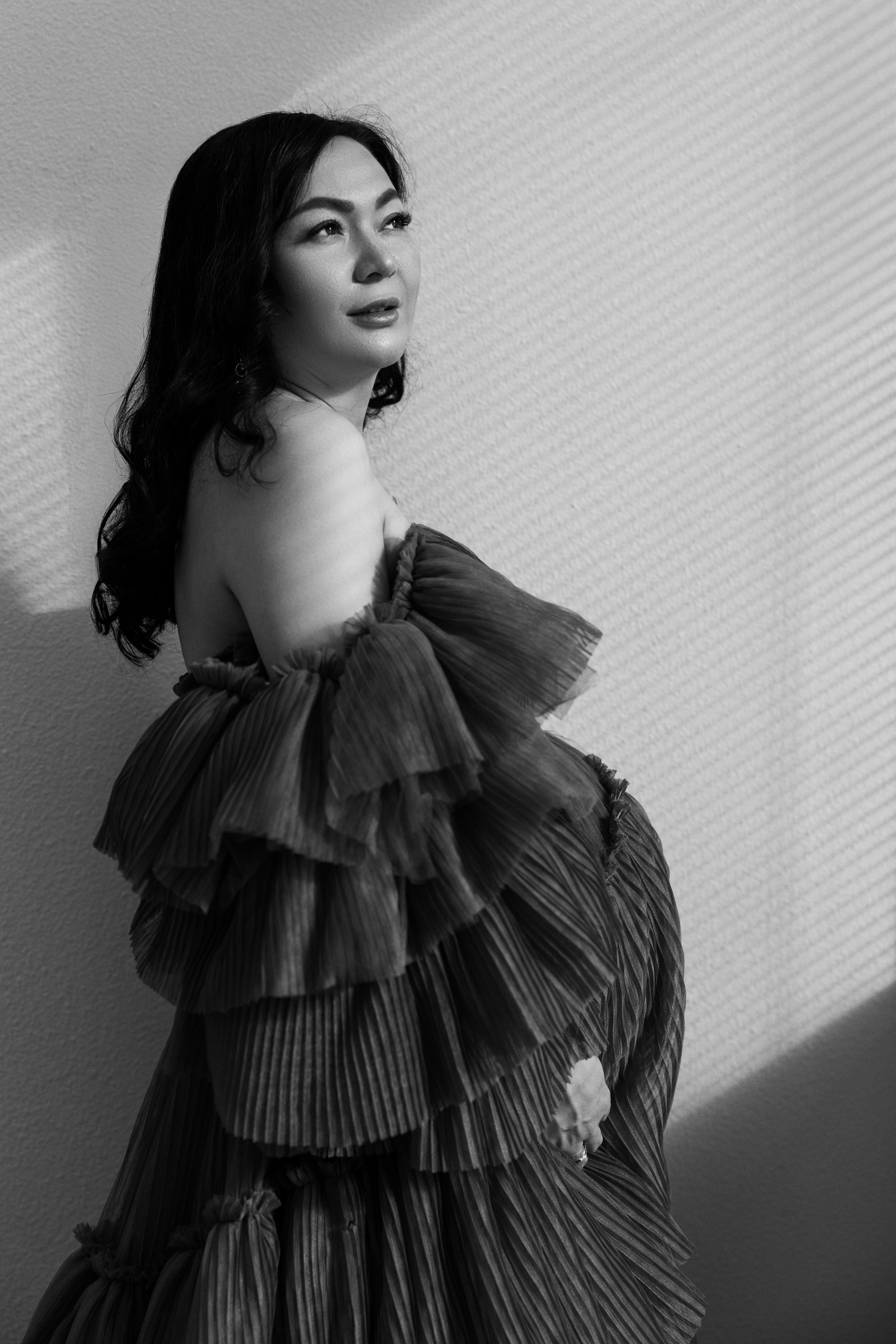 Pregnancy photo session with husband in studio