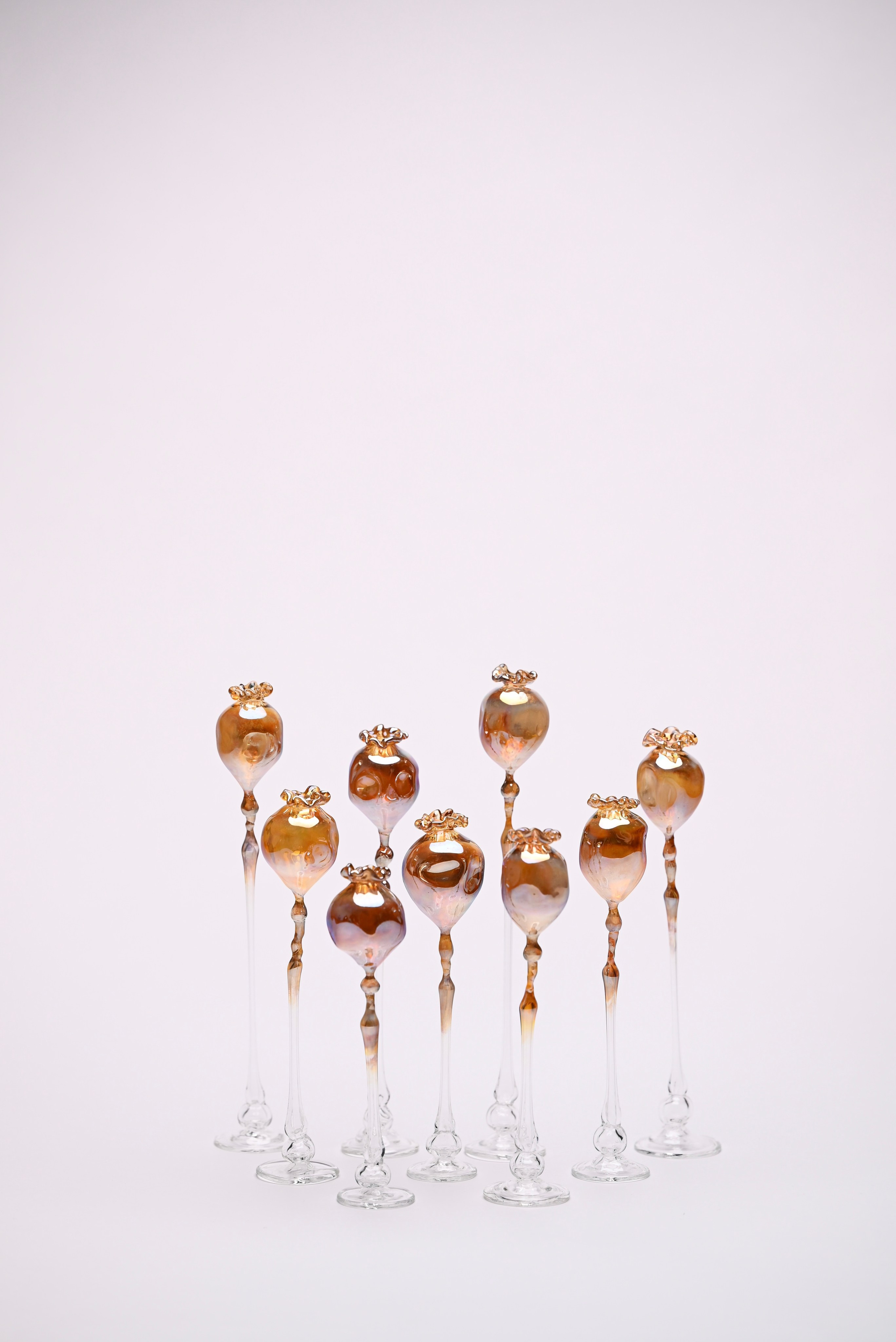 Candlestick series .Borosilicate glass, silver fuming.Overall dimensions: 28 × 26 × 11 cm. 2026 