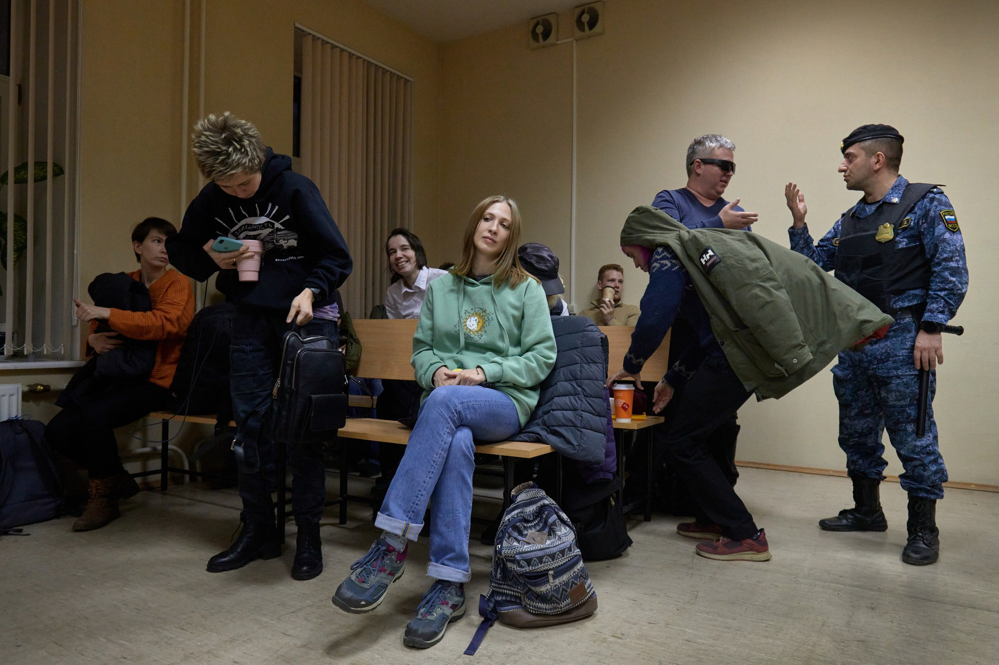 Sonya Subbotina (center), Sasha Skochilenko’s partner, sits in the courtroom awaiting the start of the hearing. From day one, Sonya attended every single one of Sasha’s hearings for over a year. Until they were granted visitation, these hearings were their only chance to see each other, though they were unable even to touch.