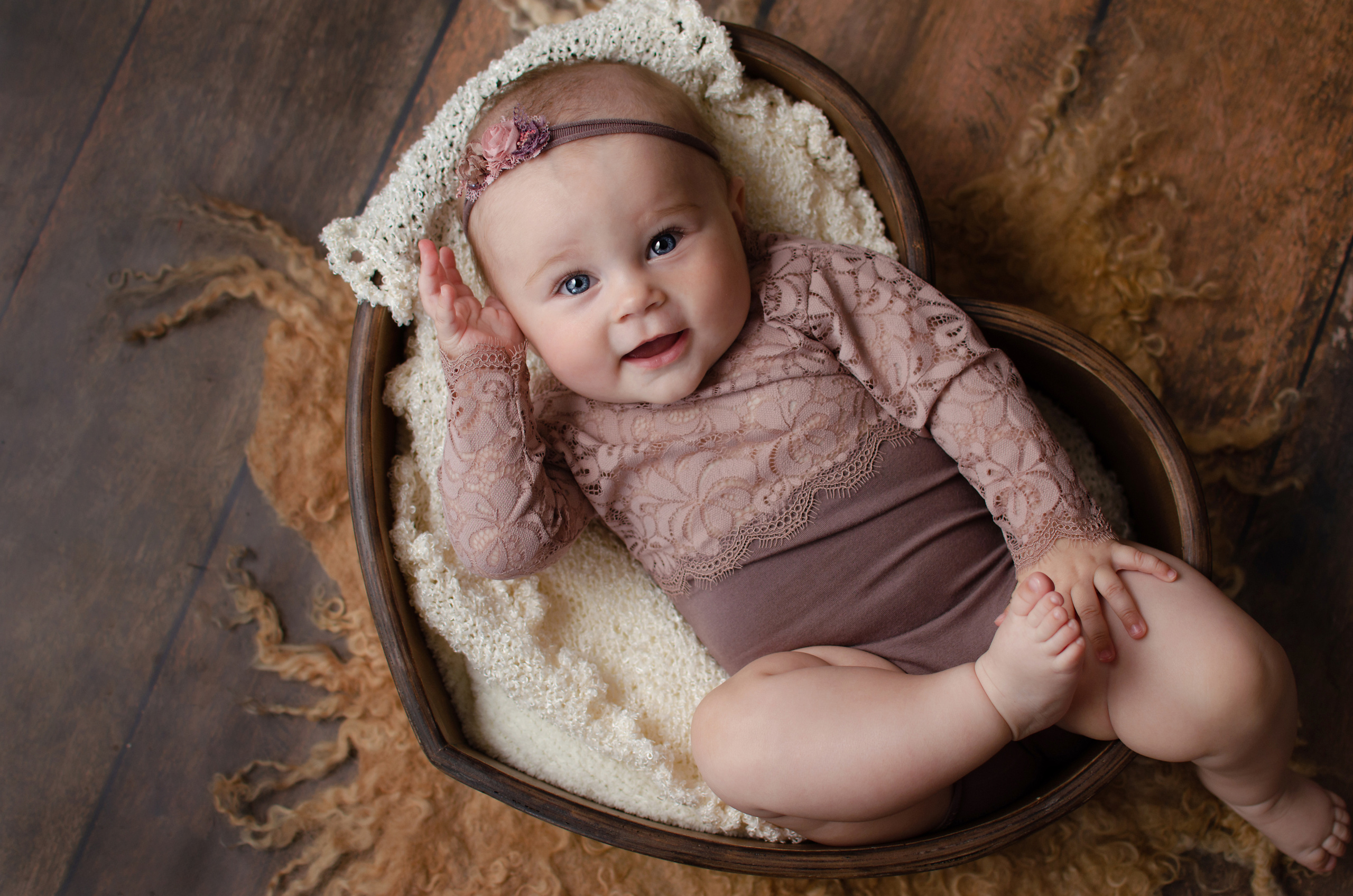 Little girl in an openwork outfit smiling