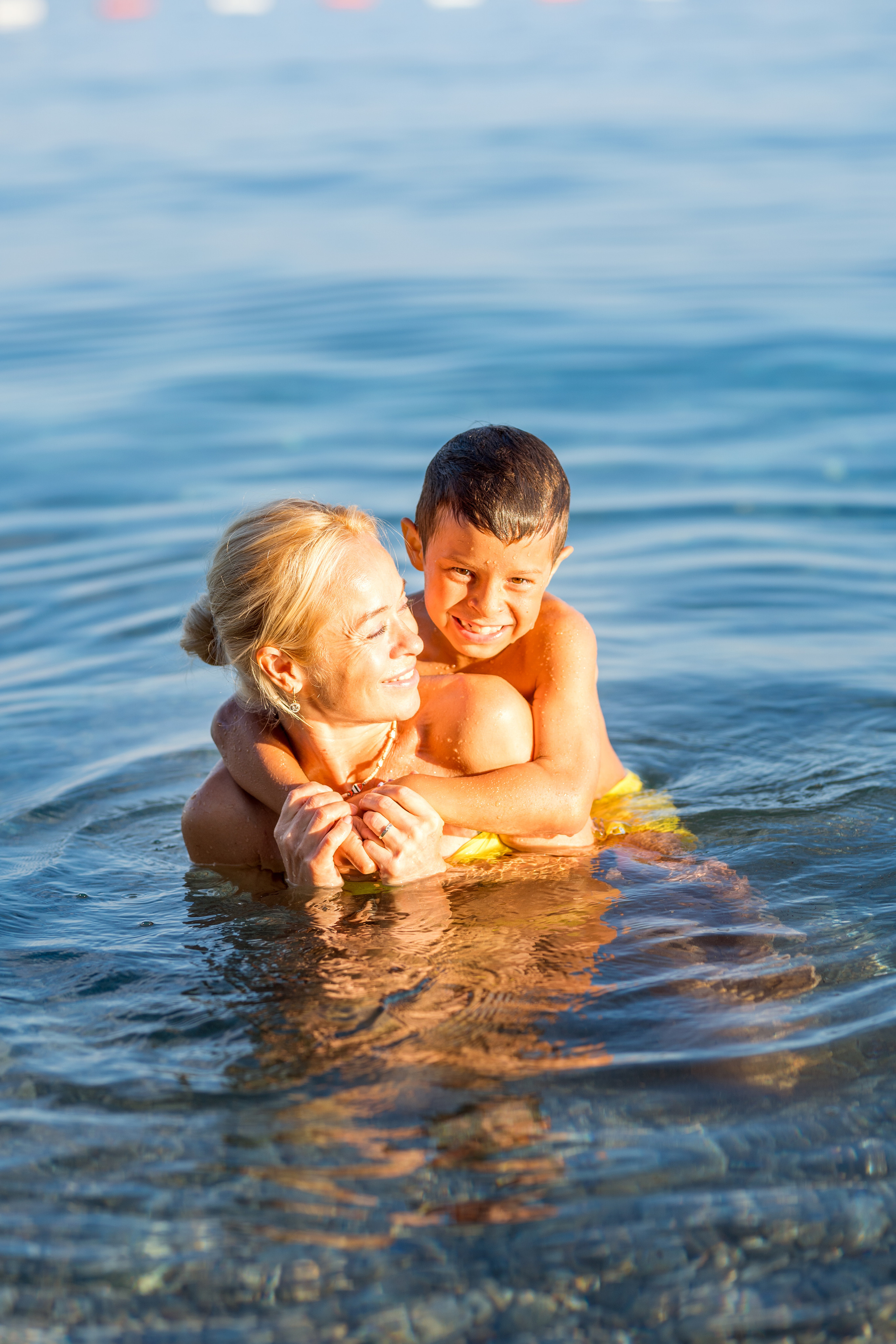 Photo session of a mother and son on the beach in Budva, Montenegro. Kate Khaldeeva photographer in Saratov