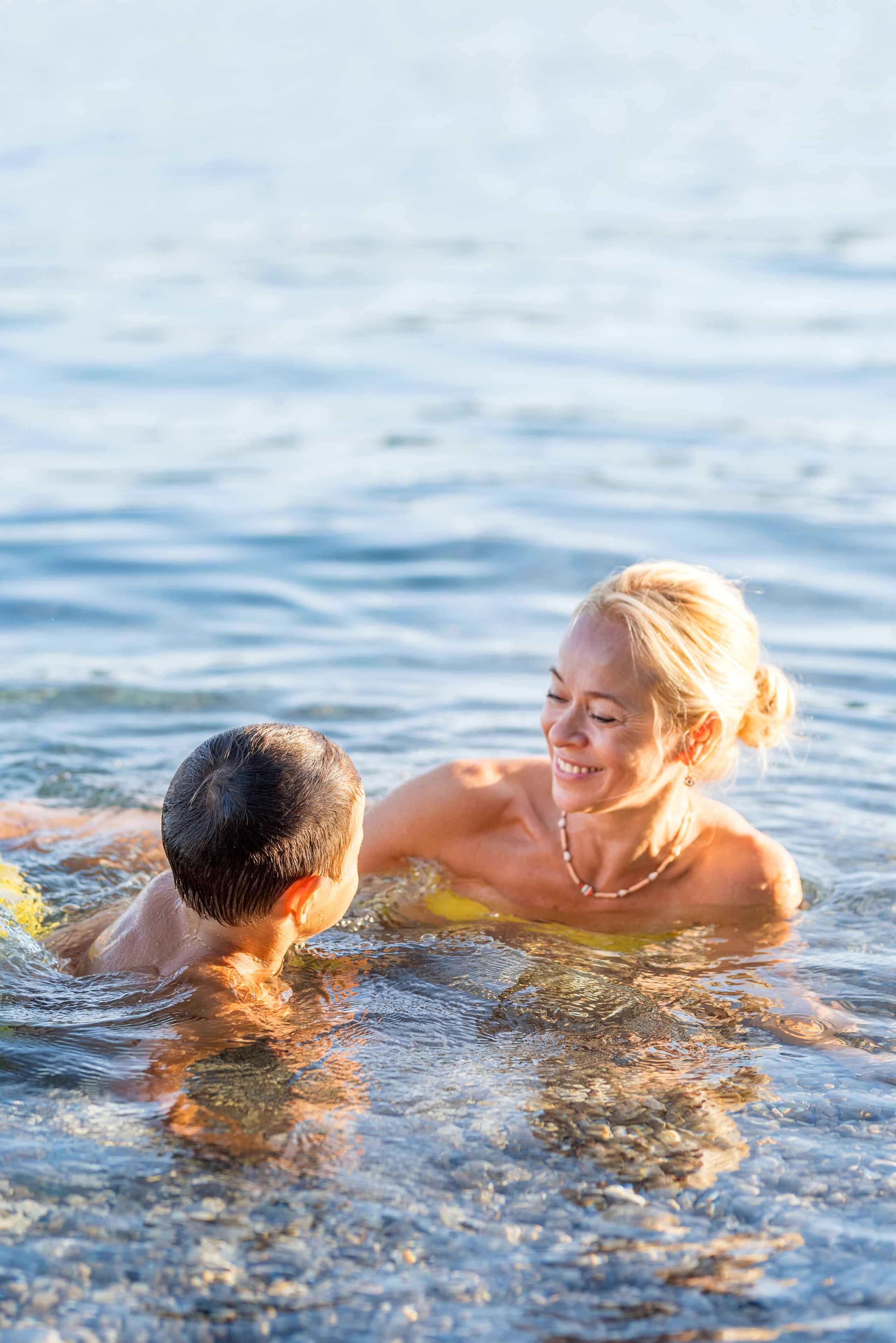 Photo session of a mother and son on the beach in Budva, Montenegro. Kate Khaldeeva photographer in Saratov