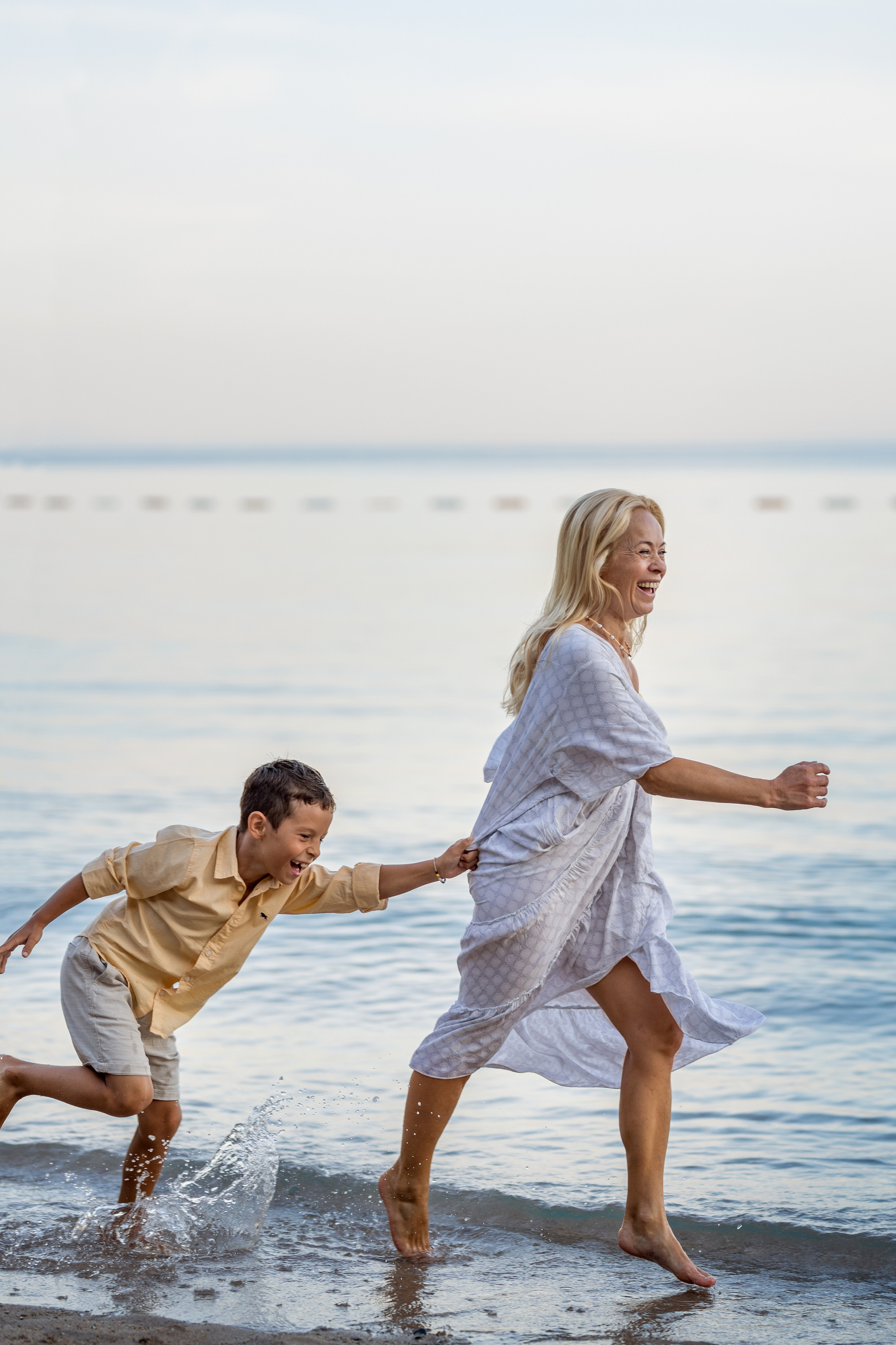 Photo session of a mother and son on the beach in Budva, Montenegro. Kate Khaldeeva photographer in Saratov