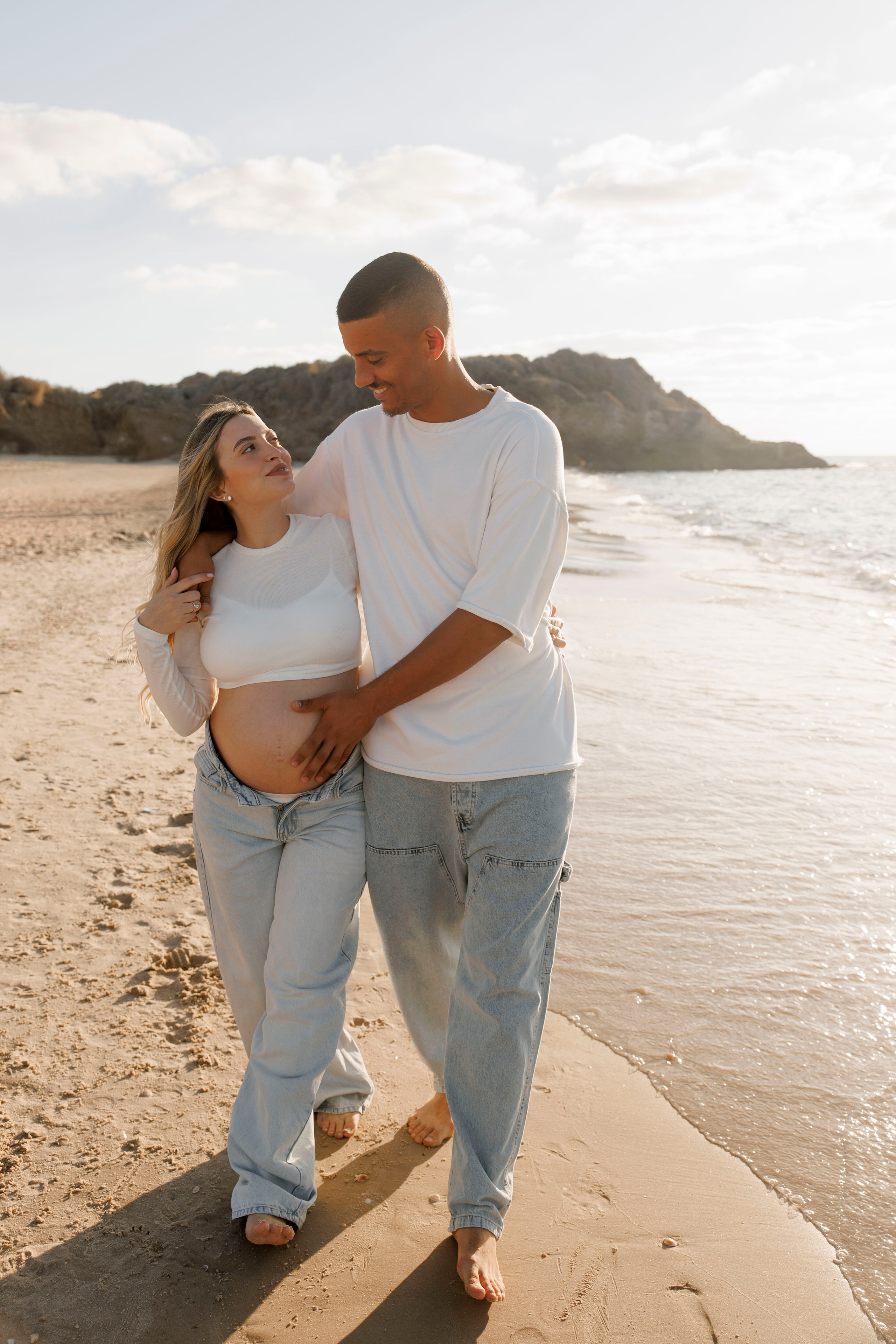 Pregnancy photoshoot near the sea. Wedding and family photographer