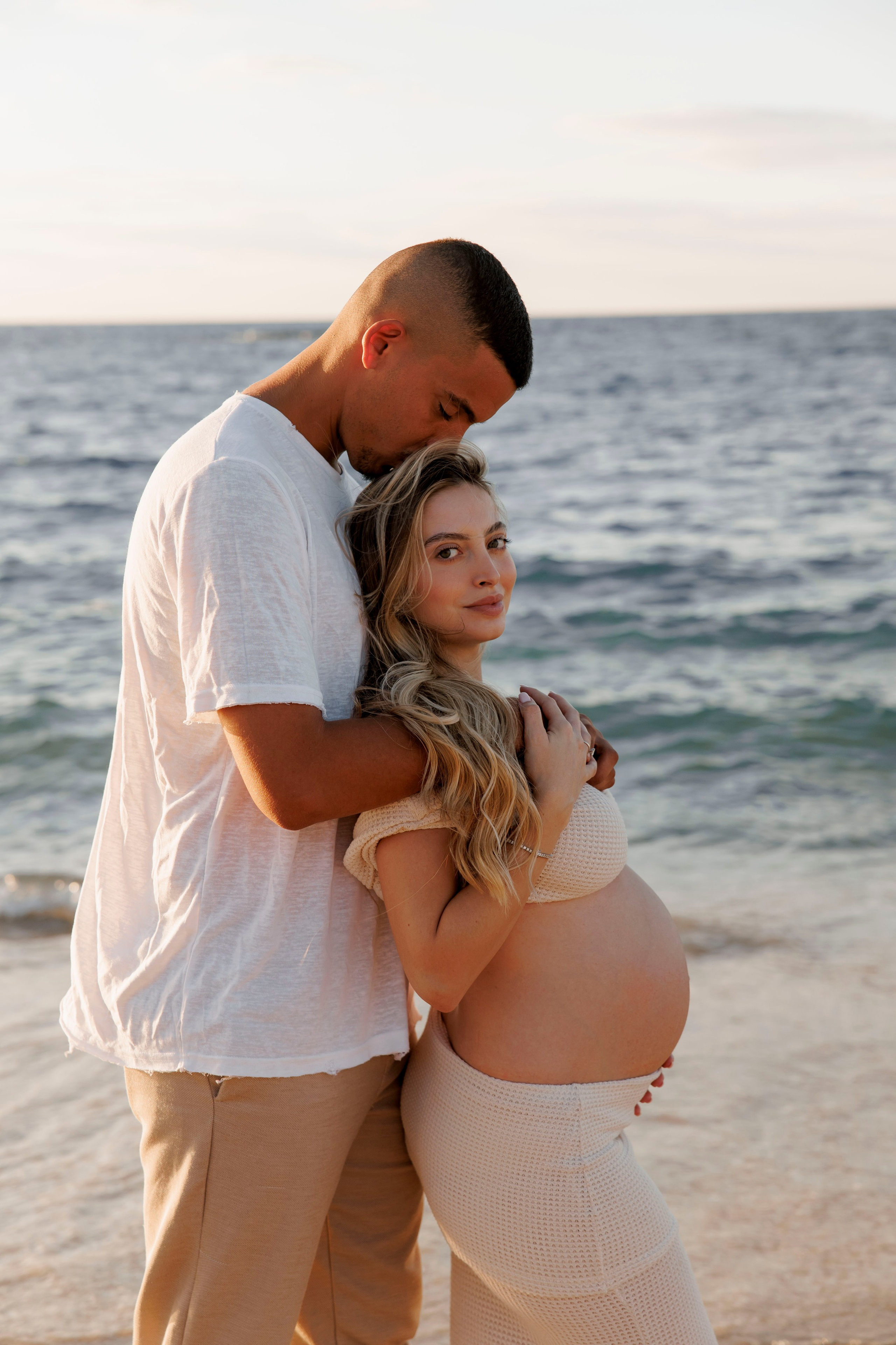 Pregnancy photoshoot near the sea. Wedding and family photographer