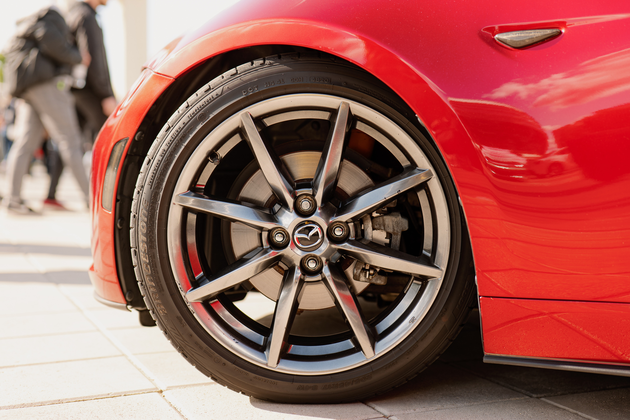 Red Mazda wheel, automotive photography, auto show