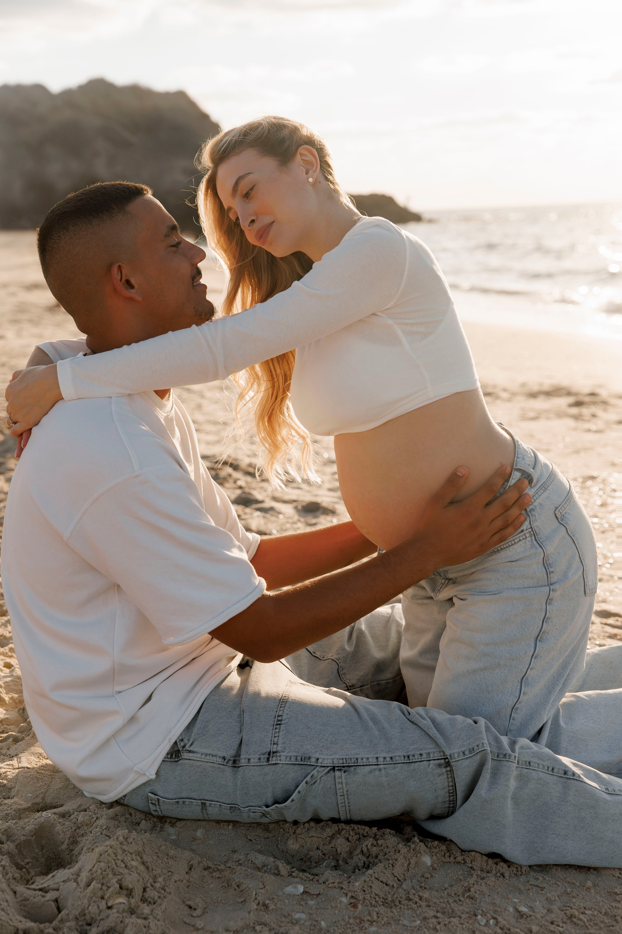Pregnancy photoshoot near the sea. Wedding and family photographer