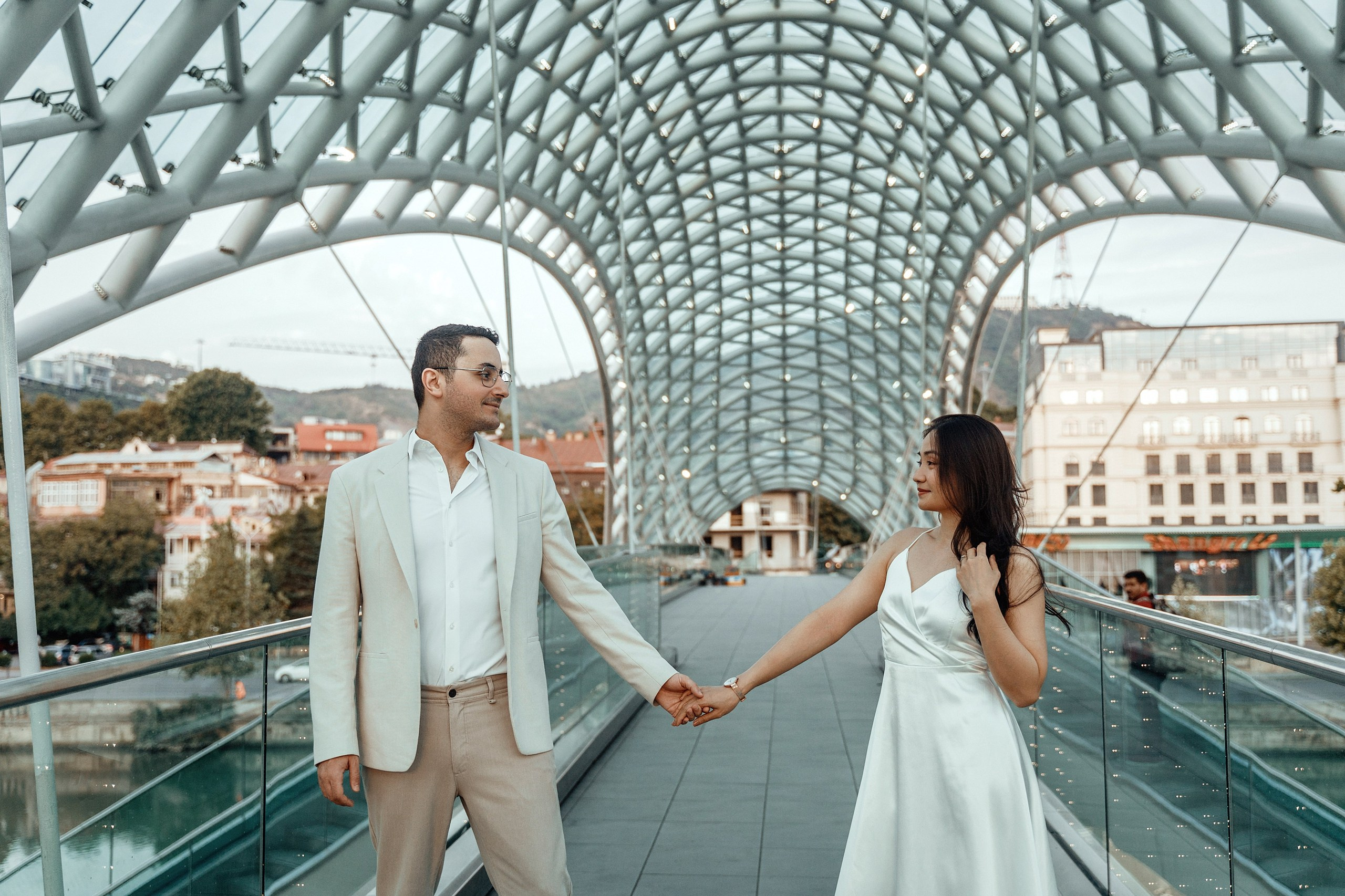 Alaeddine & Matika on the Peace Bridge in Tbilisi. Photographer Sergey Otkrytyi in Batumi & Tbilisi