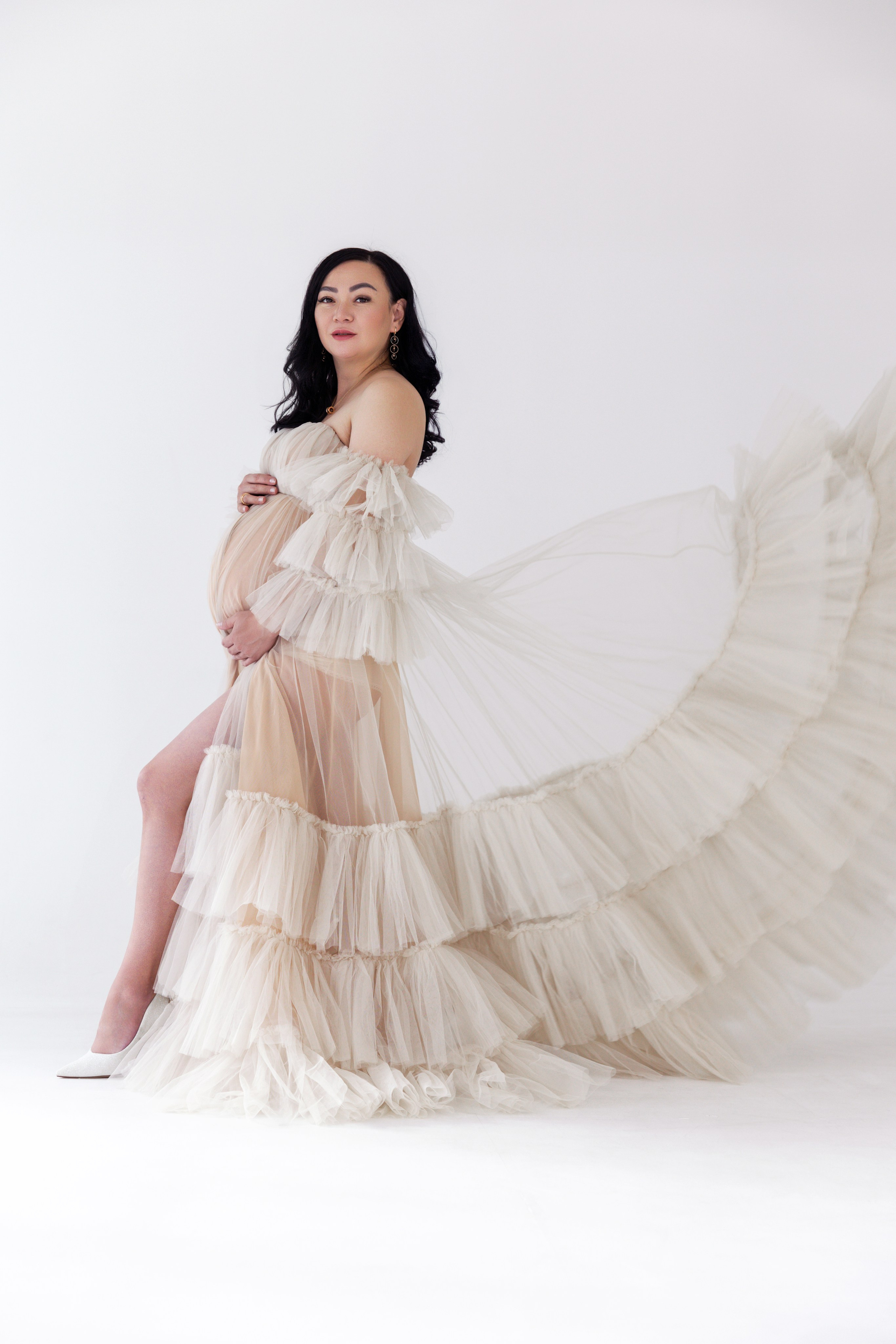 Pregnancy photo session with husband in studio