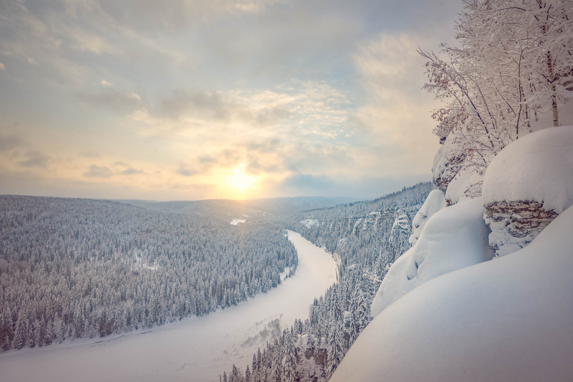 Panoramic view of the Usva pillars and the frozen Usva River in winter