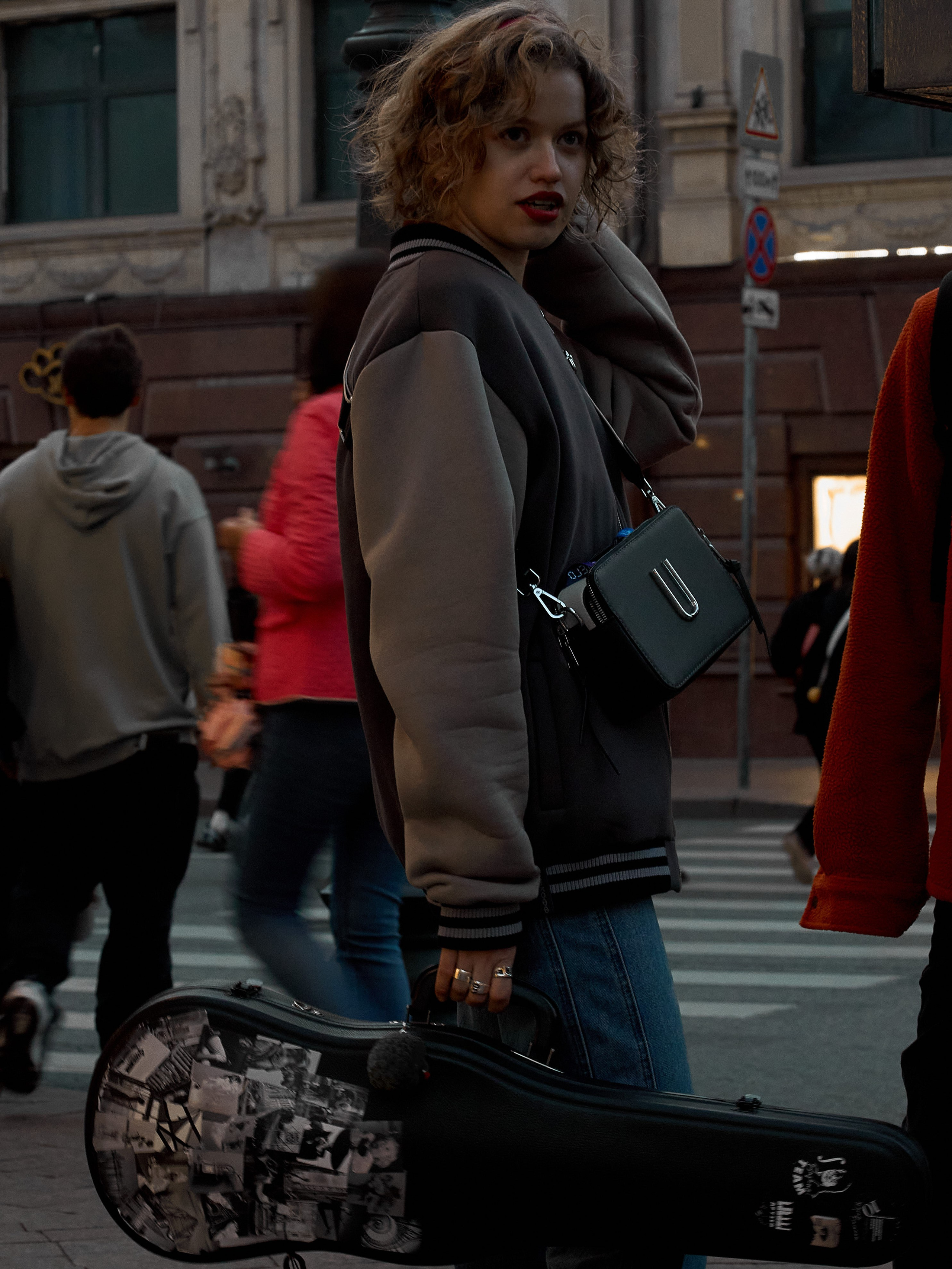 A girl with a tool on the street of Moscow. Street photography from street photographer Alexander Gladky.