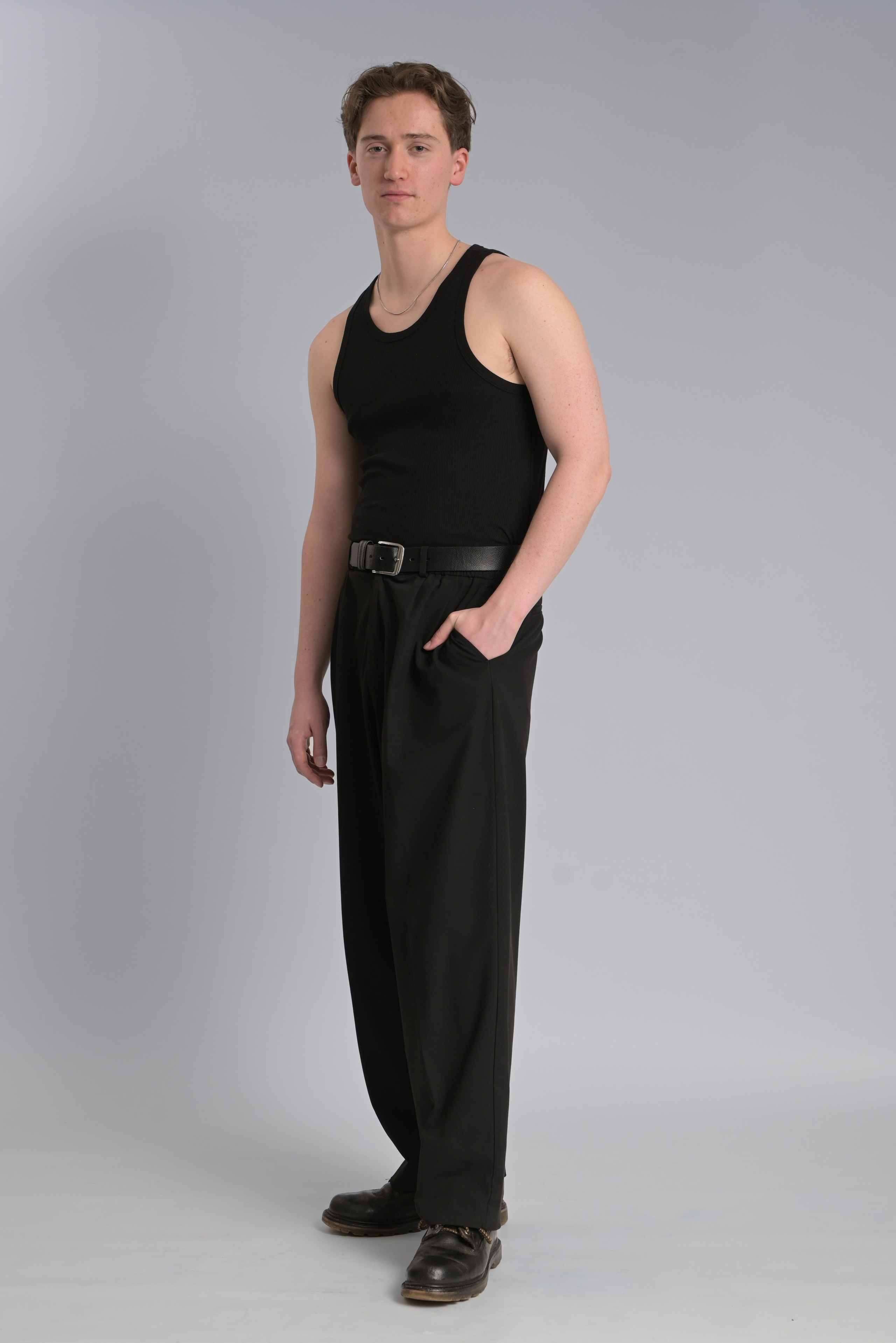 Full-length model digital in a black top and trousers