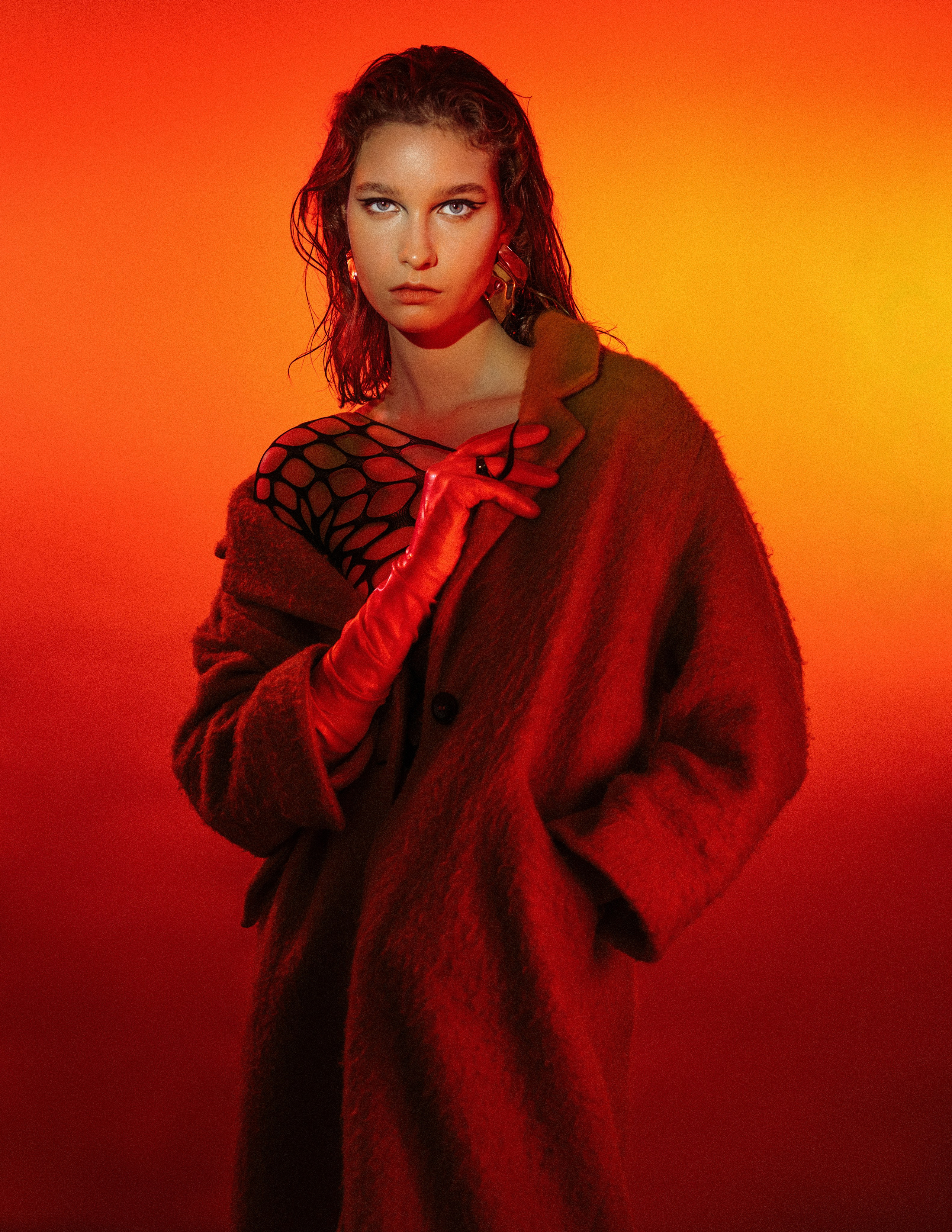 Anasta Fo modelling in a red coat