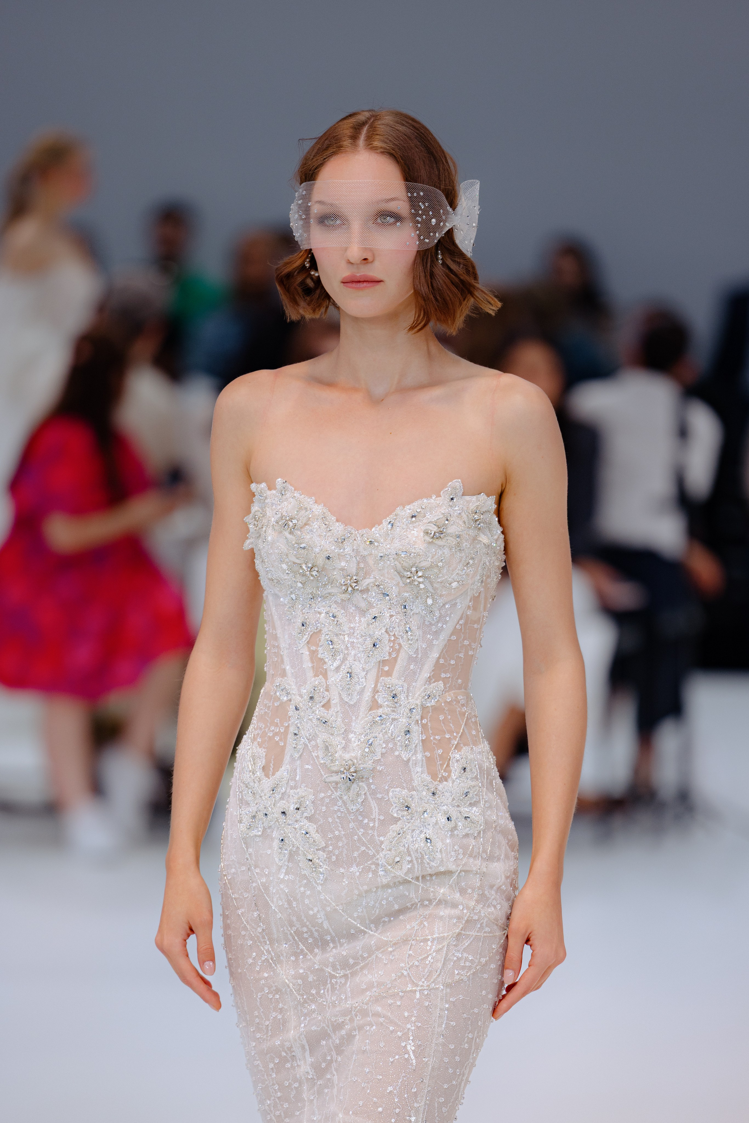 Model smiling moments before stepping on the runway