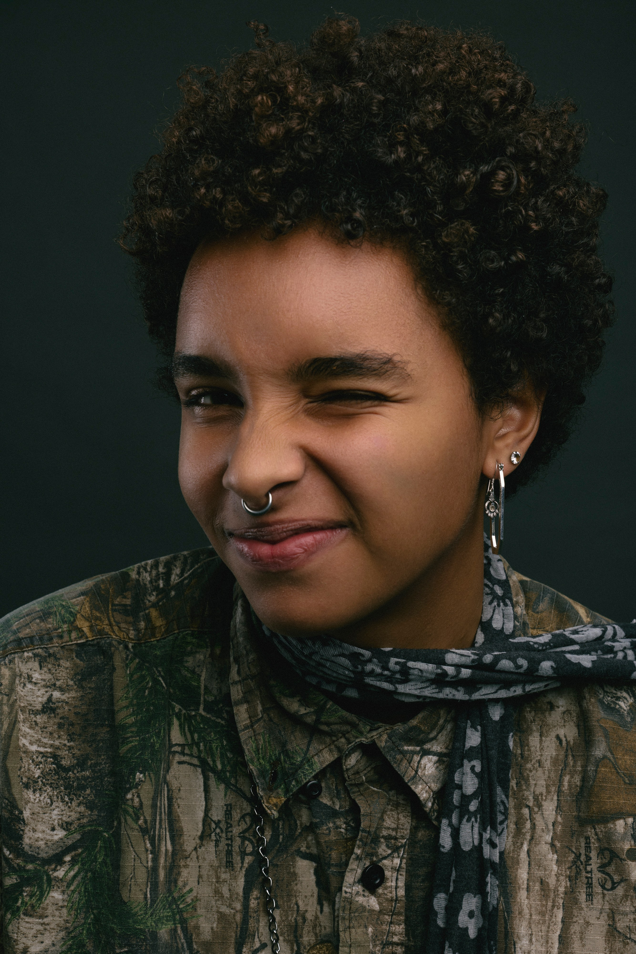 Professional editorial-style photo of a woman in a minimalist studio setting
