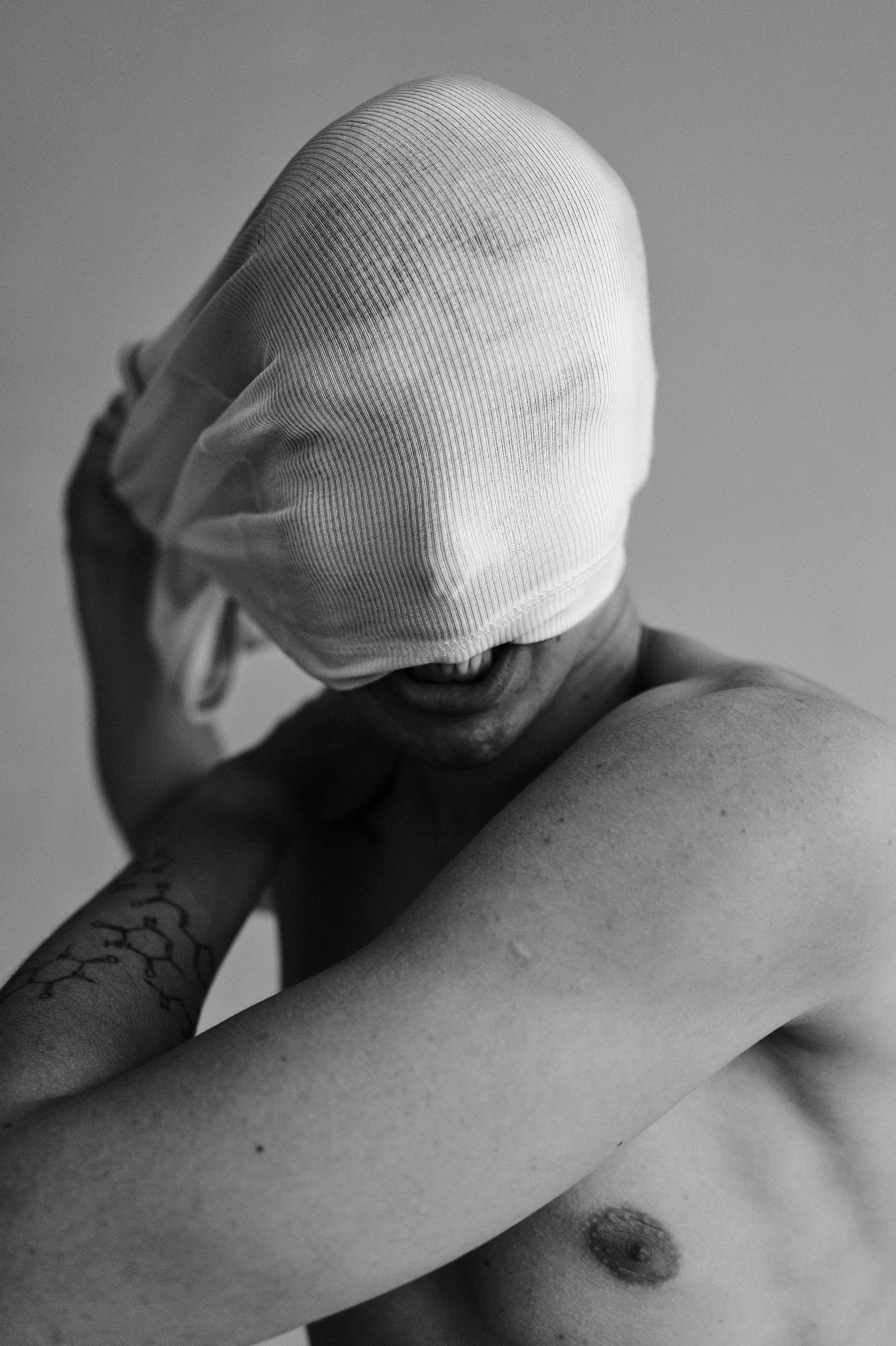 Modern black and white image of a man stretching his body in Barcelona
