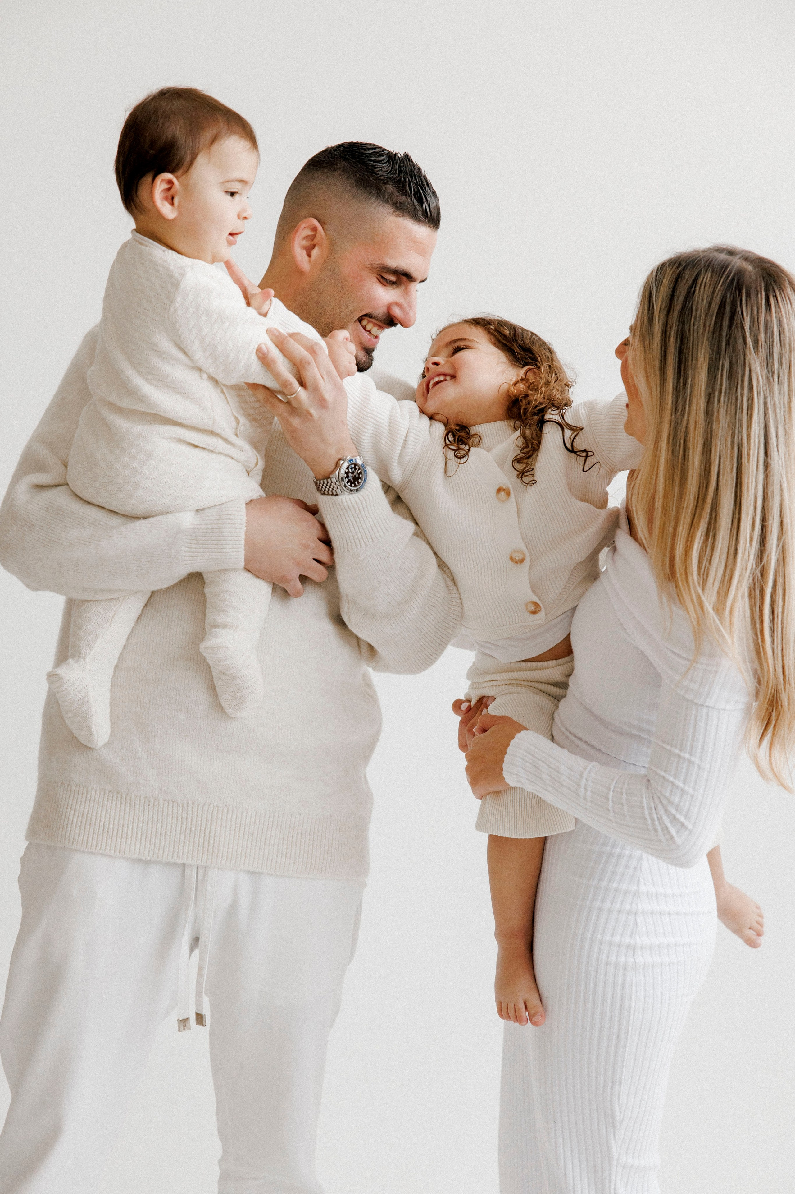 Family photoshoot in White Studio. Wedding and family photographer
