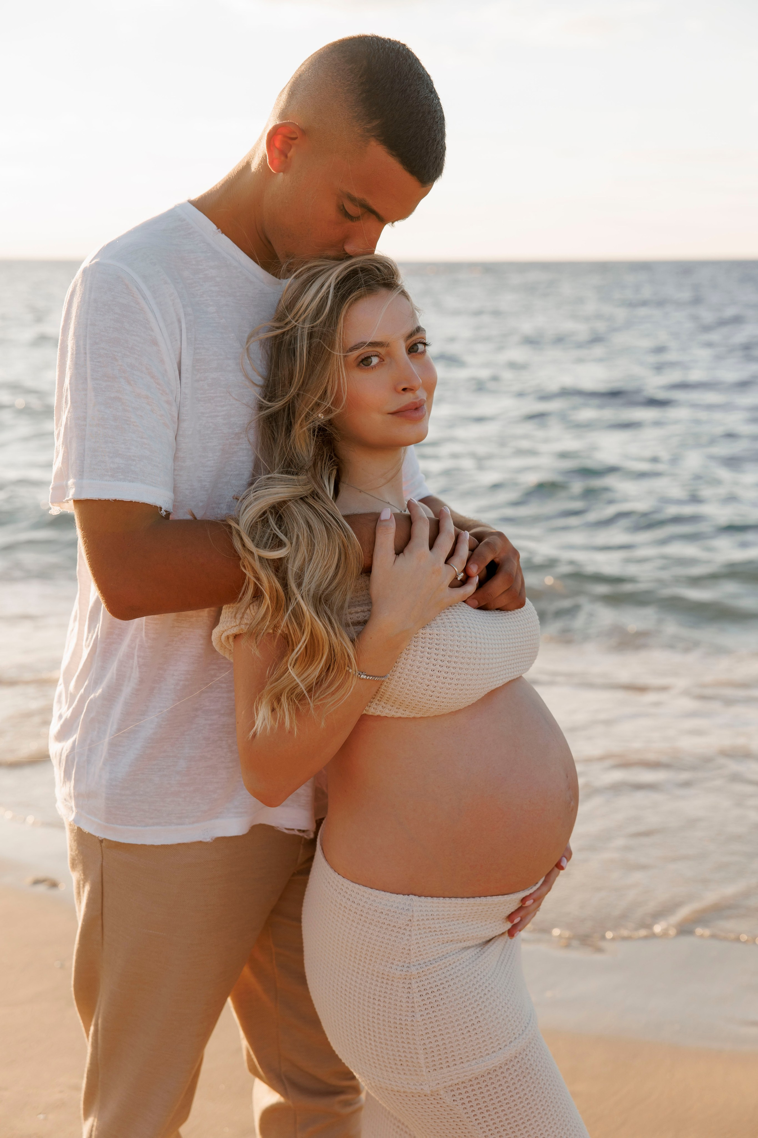 Pregnancy photoshoot near the sea. Wedding and family photographer